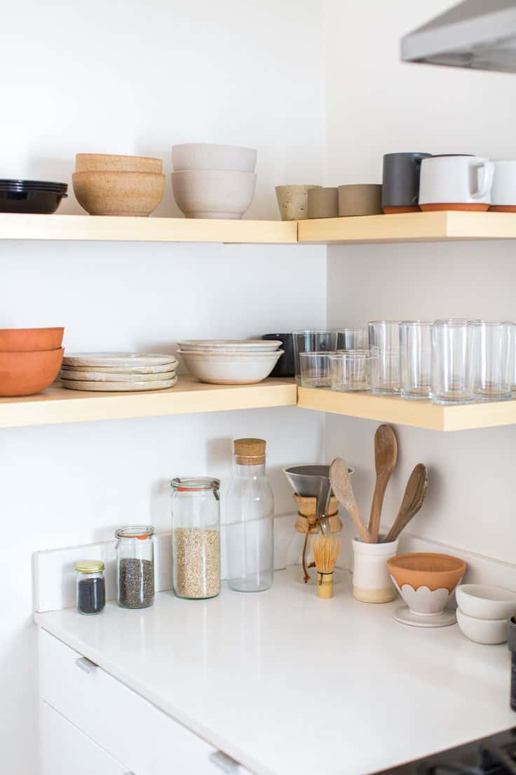 minimalist kitchen corner, light wood shelves, terracotta bowls, SD Phone Wallpaper