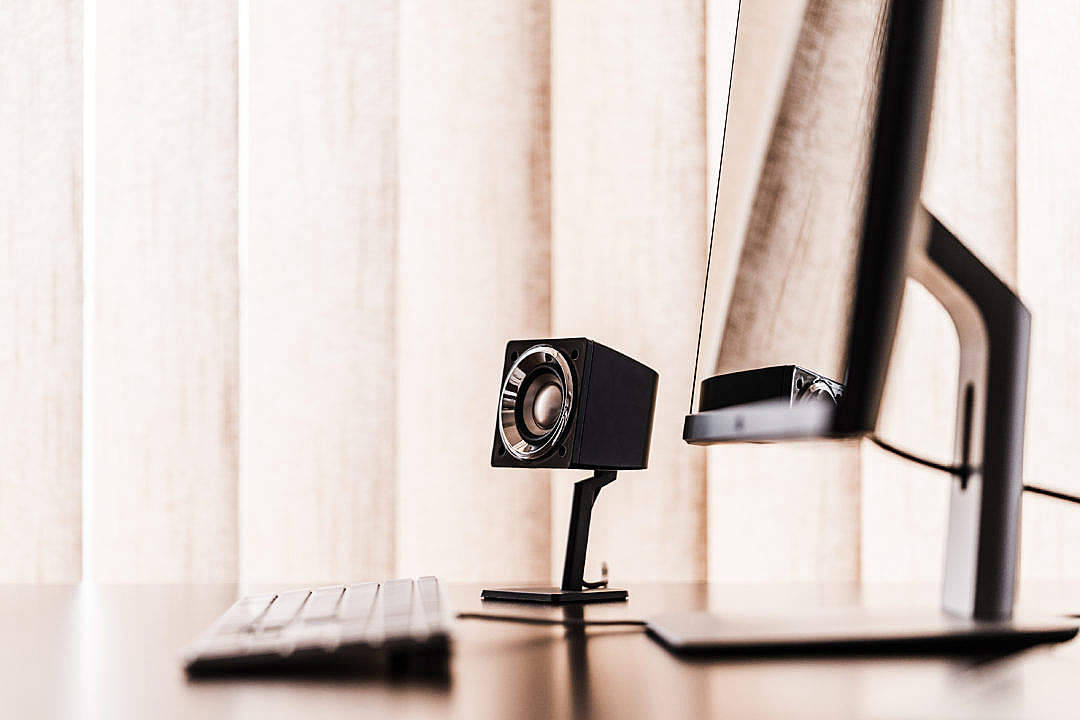 sleek black desktop speaker, polished desk, keyboard, SD Desktop Wallpaper
