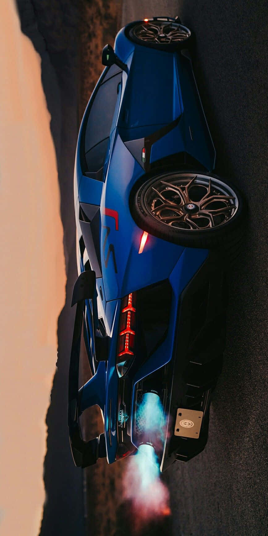 blue sports car, glowing exhaust flames, desert road, HD Phone Wallpaper