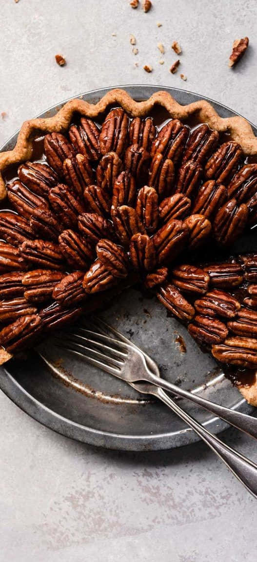 pecan pie, glossy caramelized nuts, rustic metal plate, SD Phone Wallpaper