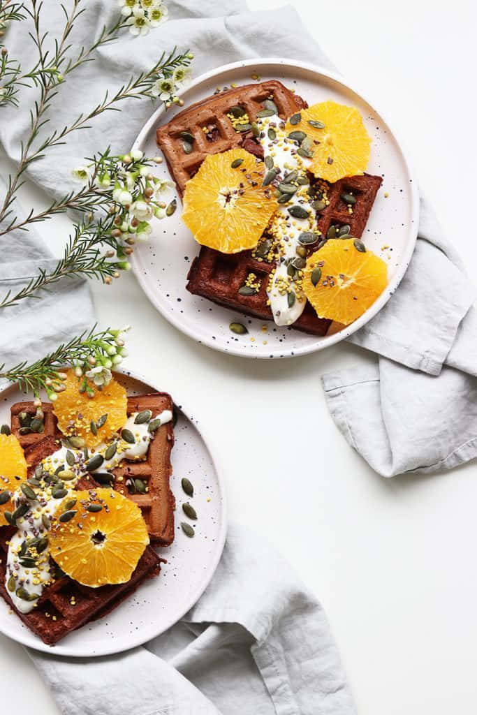 minimalist food, golden waffles, orange slices, SD Phone Wallpaper