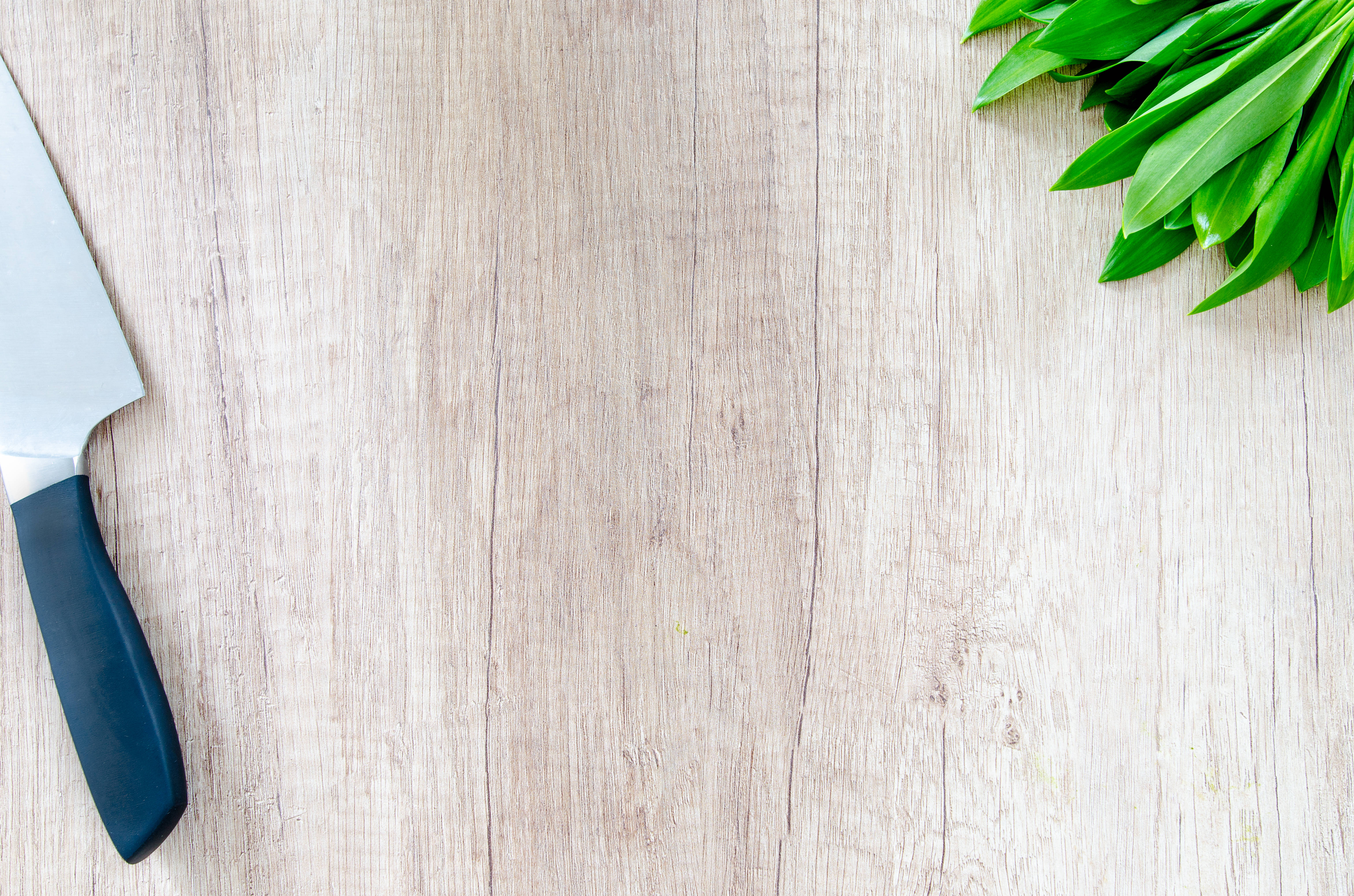 minimalist wooden cutting board, chef's knife, blue handle, 5K Desktop Wallpaper