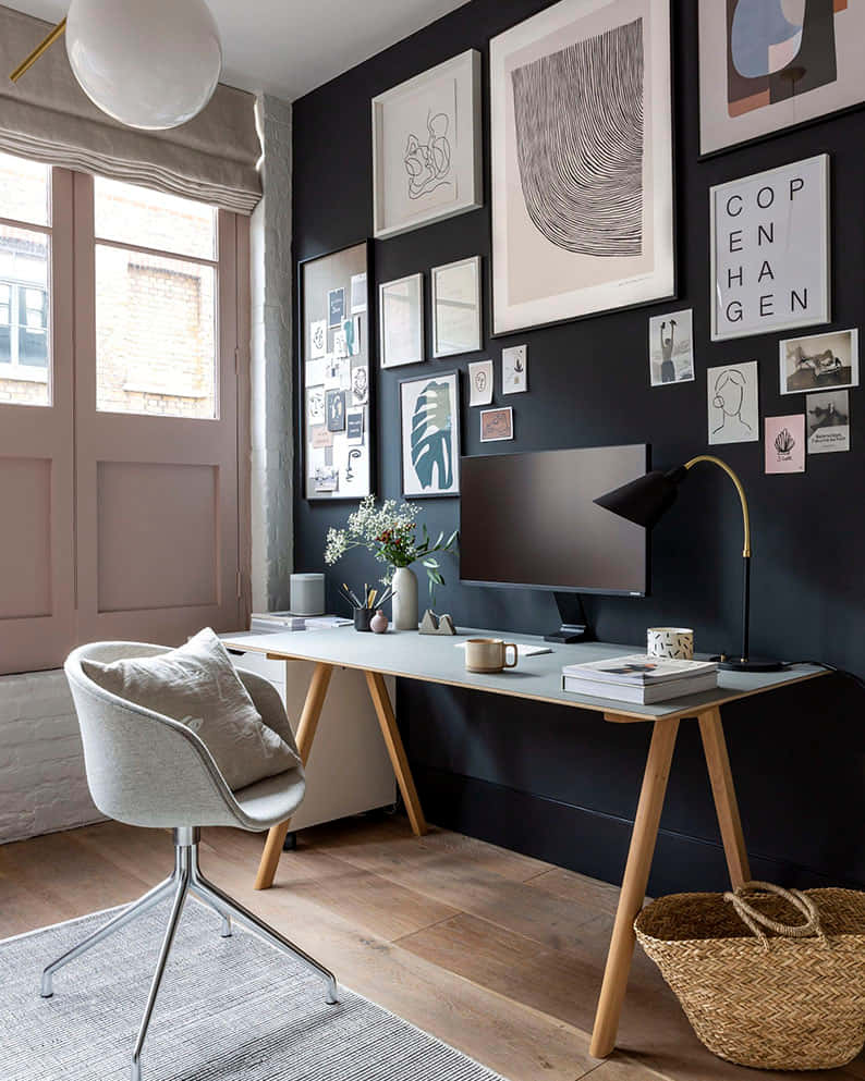black accent wall, framed art and photos, light wood desk, SD Phone Wallpaper