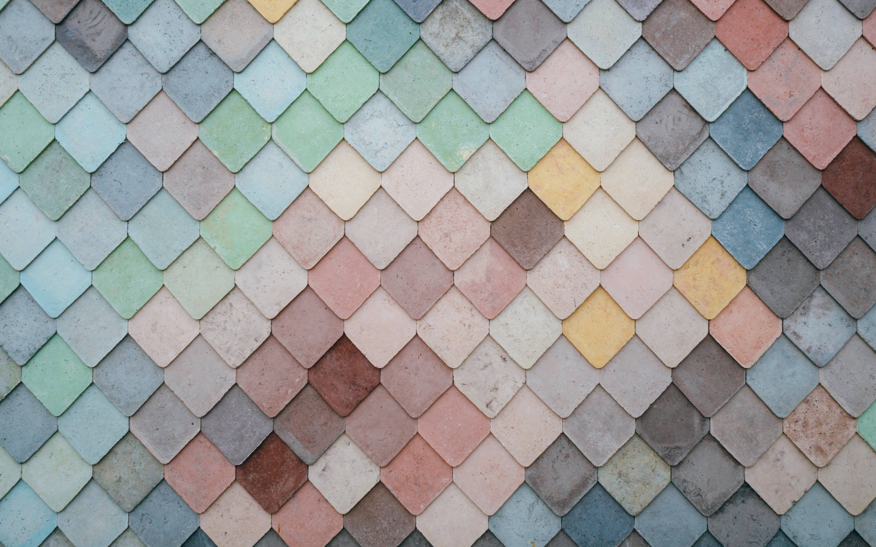 pastel-colored tiles, repeating diamond pattern, textured wall, 2K Desktop Wallpaper