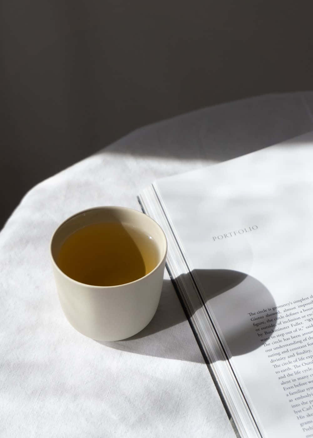 ceramic cup, golden tea, open portfolio book, HD Phone Wallpaper