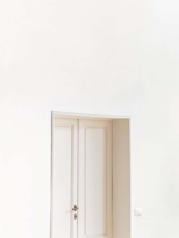 minimalist door design, brass handle, plain white wall, SD Phone Wallpaper