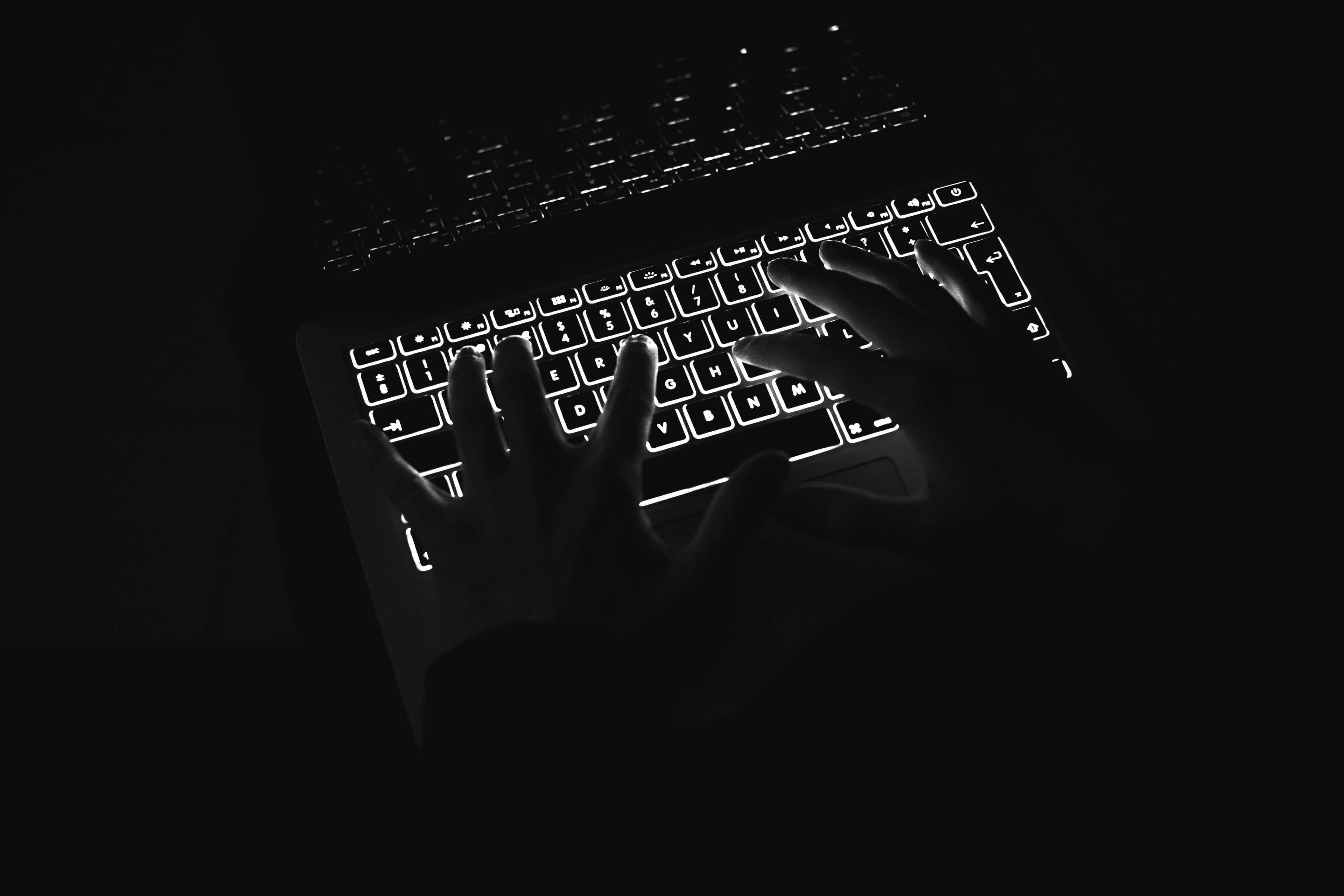 Minimalist Technology, glowing laptop keyboard, total darkness, 4K Desktop Wallpaper