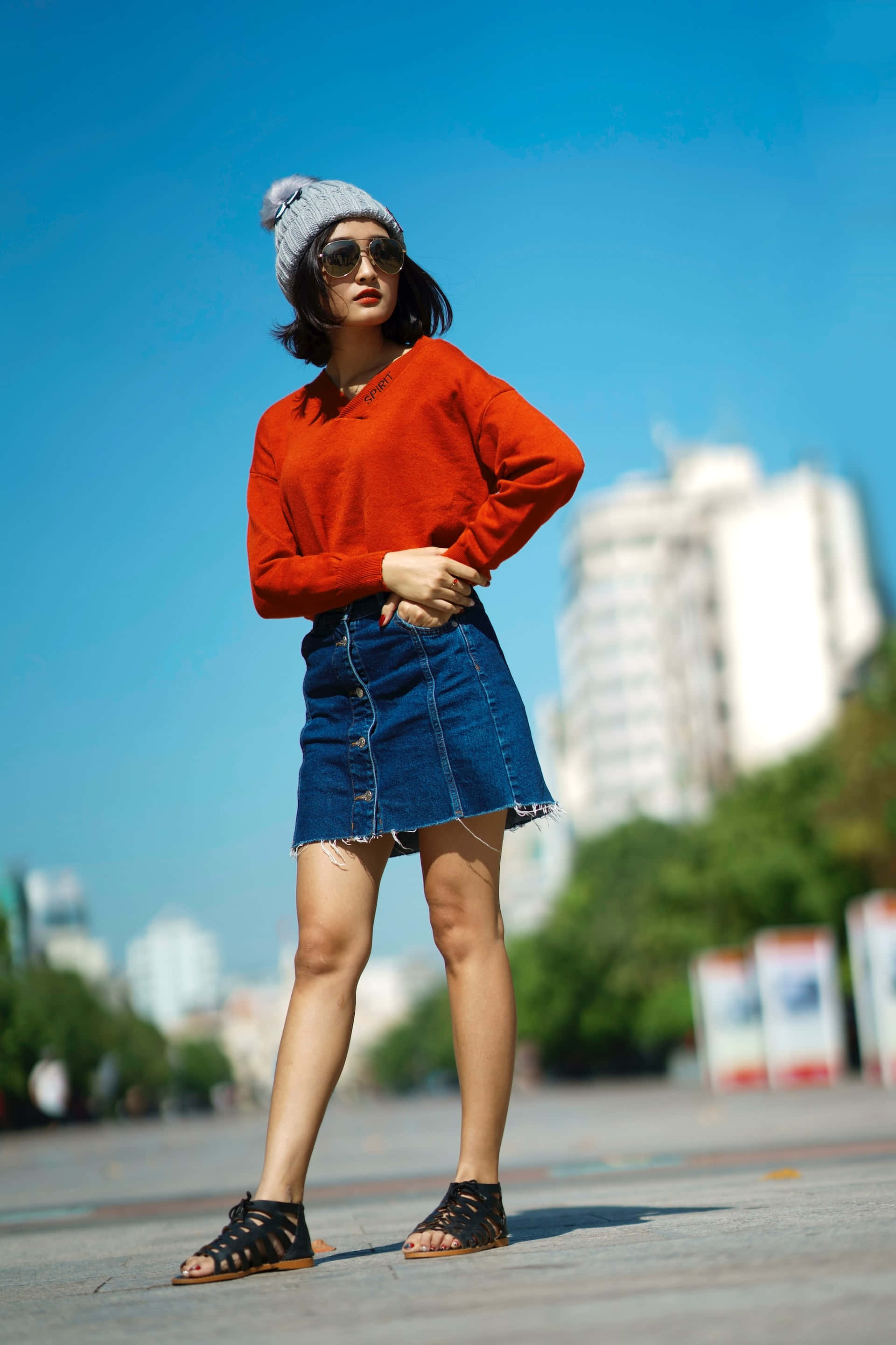 denim miniskirt, red sweater, bright blue sky, 2K Phone Wallpaper