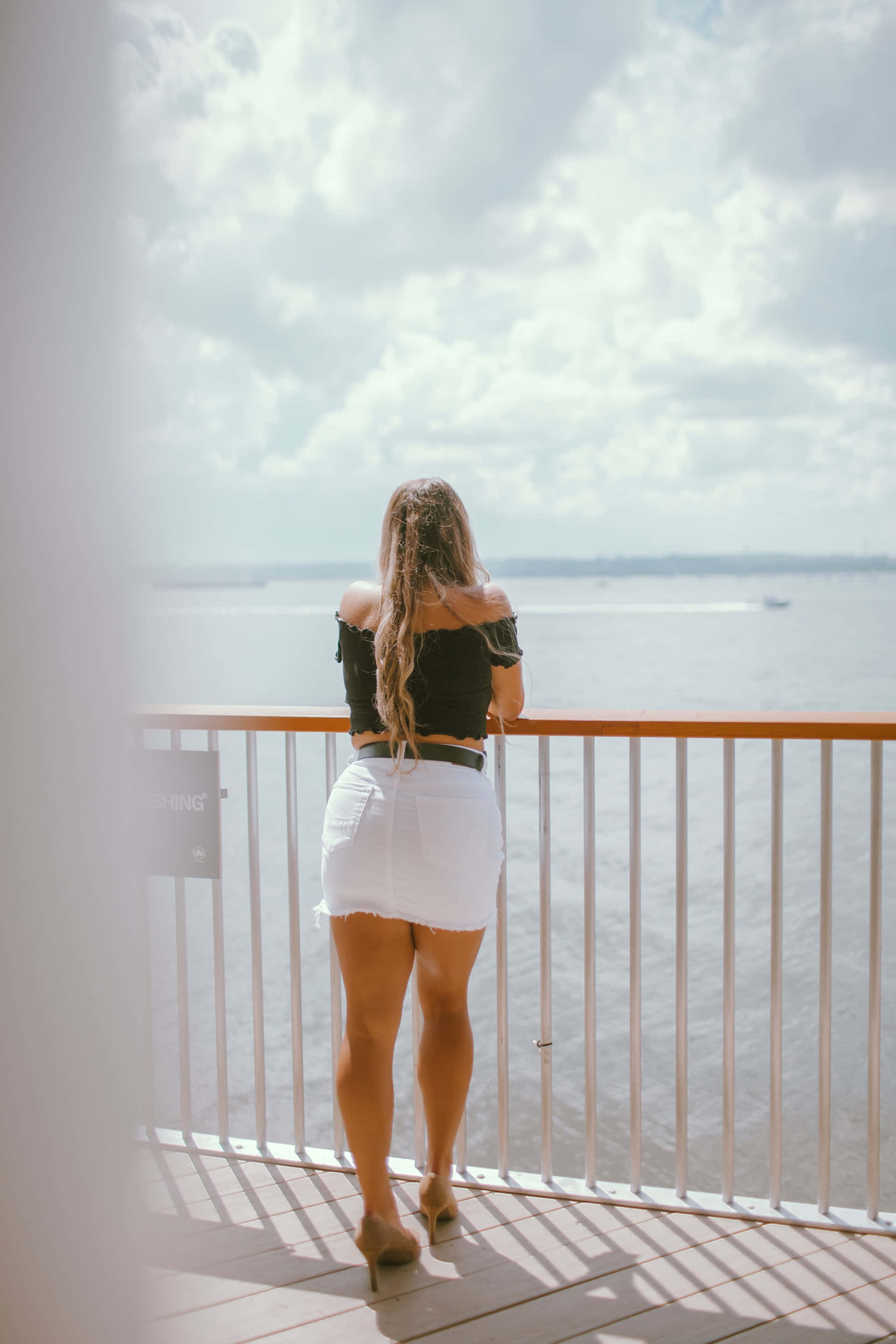 white miniskirt, black top, balcony railing, 2K Phone Wallpaper