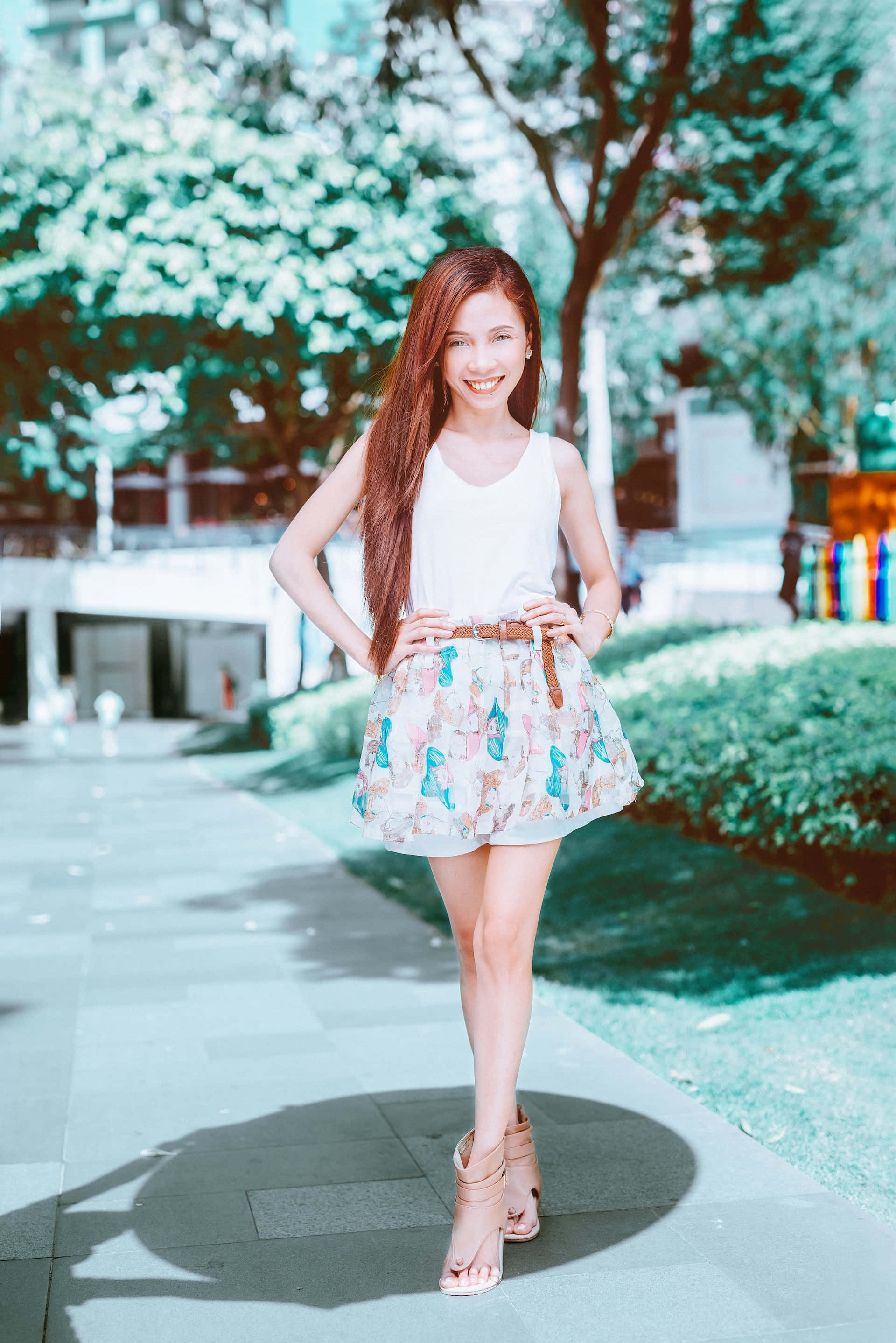 pink floral miniskirt, young woman, sunlit urban sidewalk, 2K Phone Wallpaper