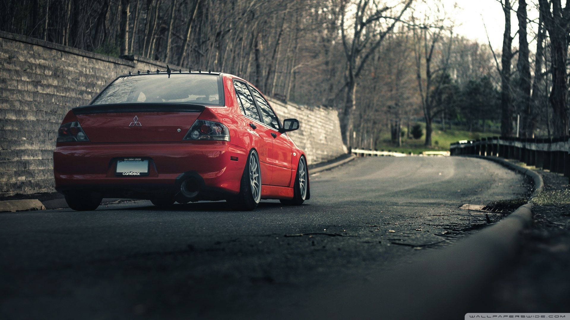 Red Mitsubishi Lancer, winding road, stone wall, Full HD Desktop Wallpaper