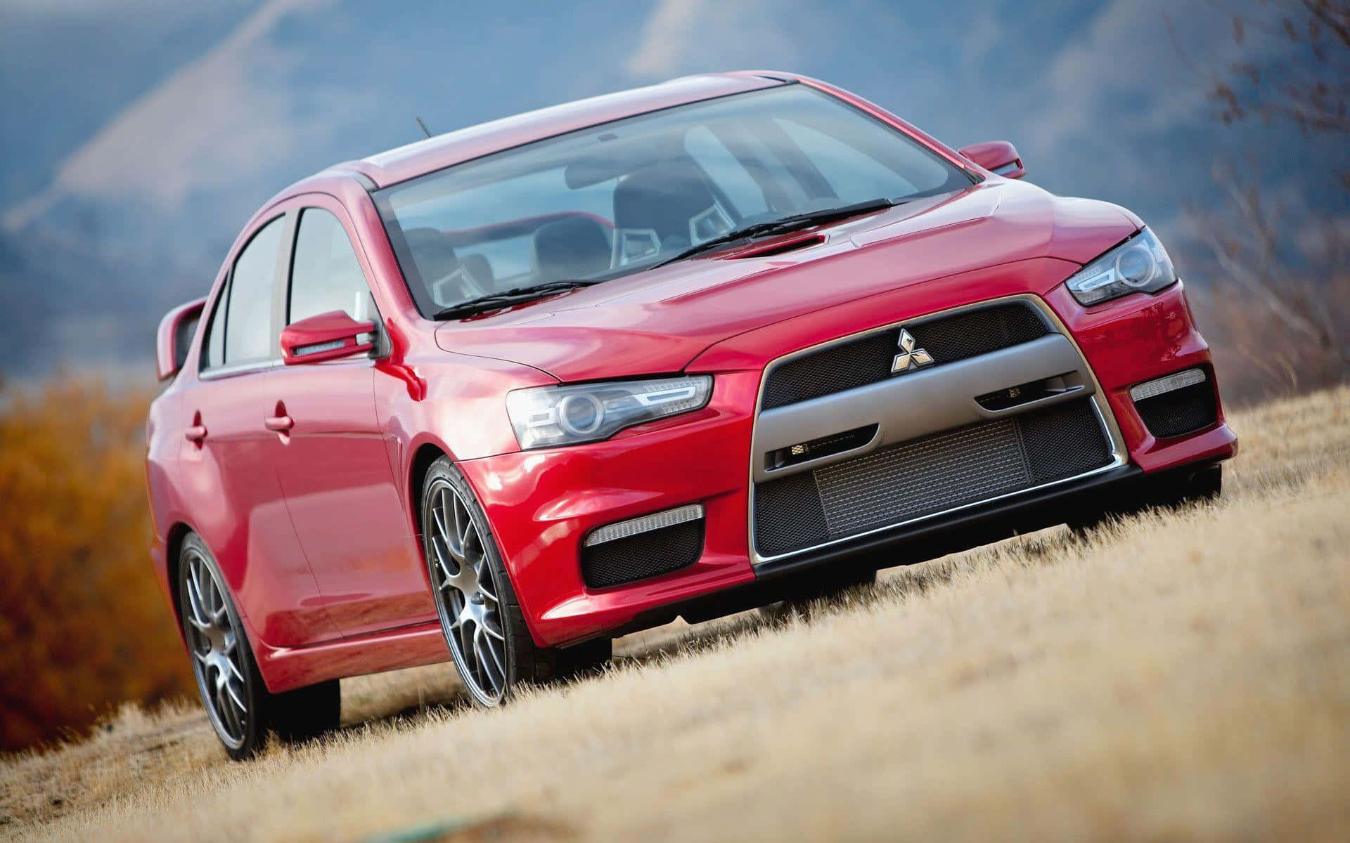 Mitsubishi Lancer Evolution, vibrant red, dry grass, Full HD Desktop Wallpaper