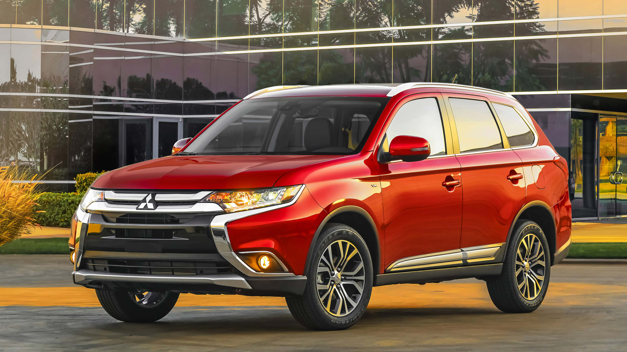 Mitsubishi Outlander, glossy red, golden hour lighting, 2K Desktop Wallpaper