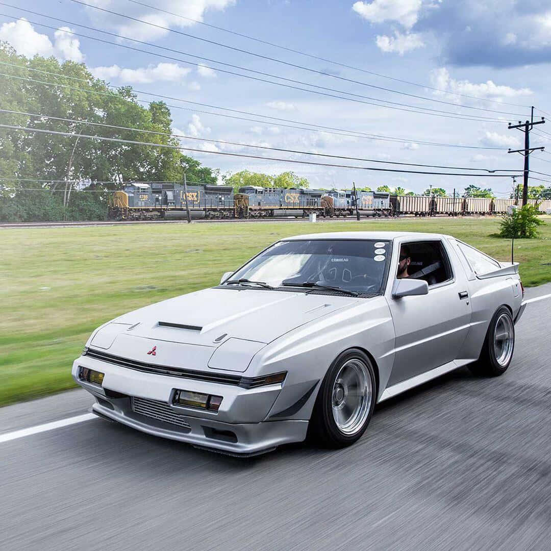 Mitsubishi Starion, silver, drifts along a roadside, SD Desktop Wallpaper