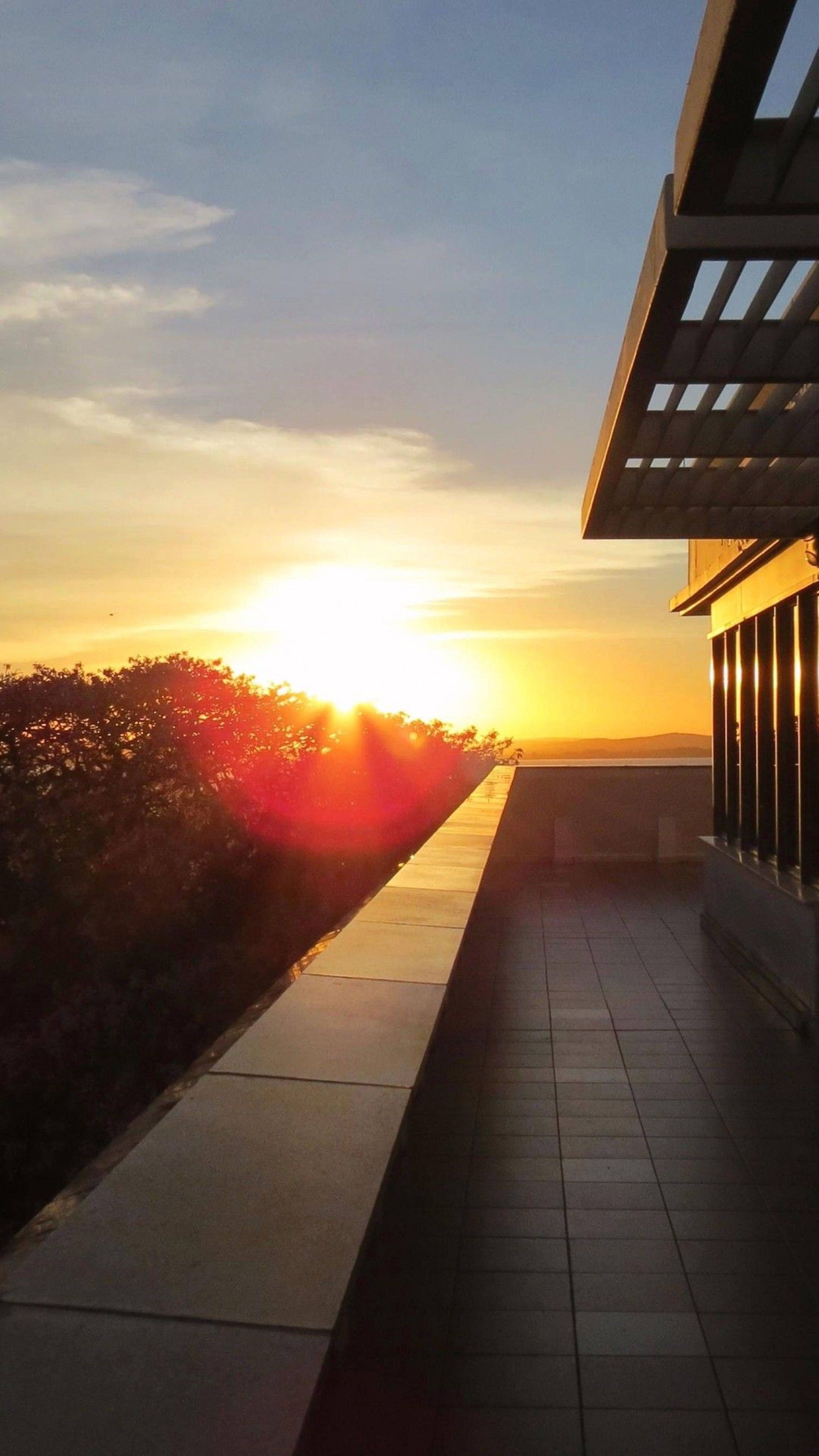 Sunset, rooftop terrace, tiled floor, 4K Phone Wallpaper