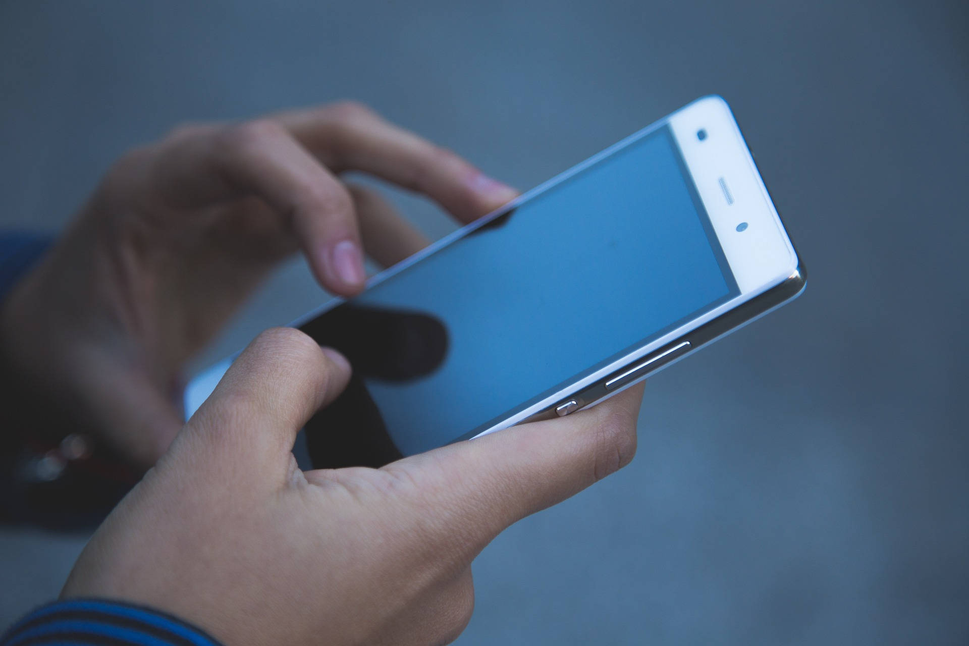 white smartphone, blue screen, muted gray background, Full HD Desktop Wallpaper