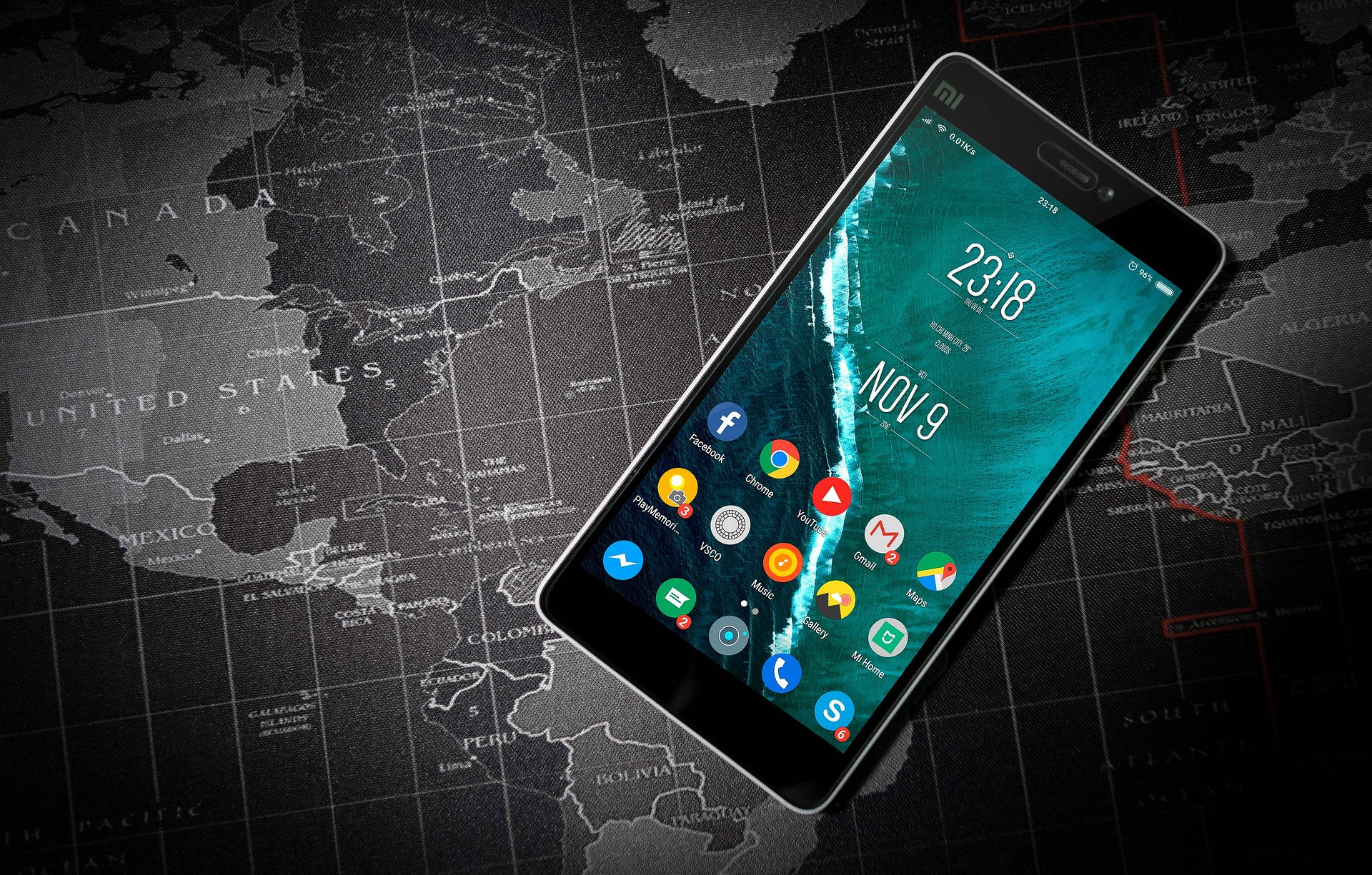 smartphone, vibrant teal ocean wallpaper, detailed grayscale world map, Full HD Desktop Wallpaper