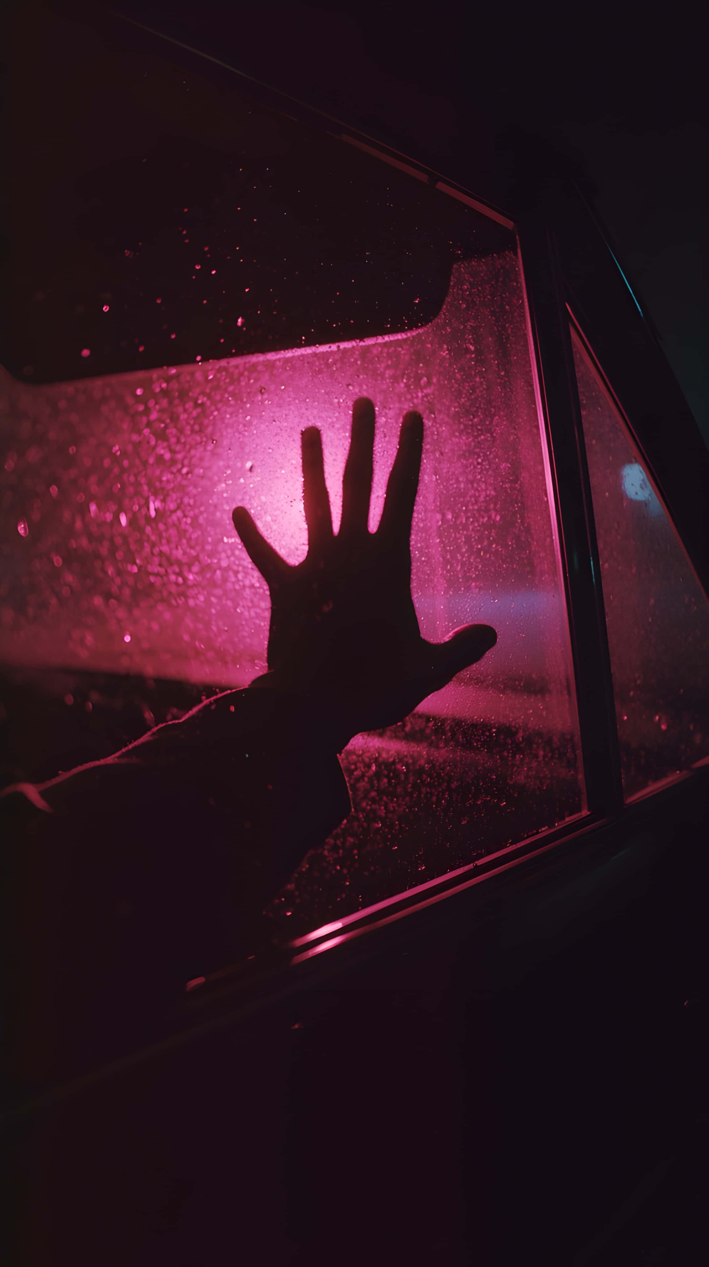 neon hand, rain-speckled window, intense pink light, 4K Phone Wallpaper