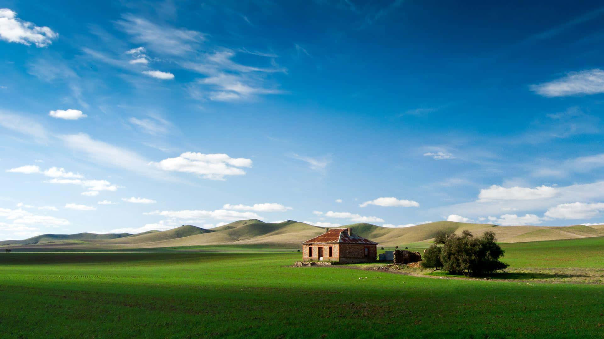 red-roofed house, vast green field, bright blue sky, Full HD Desktop Wallpaper