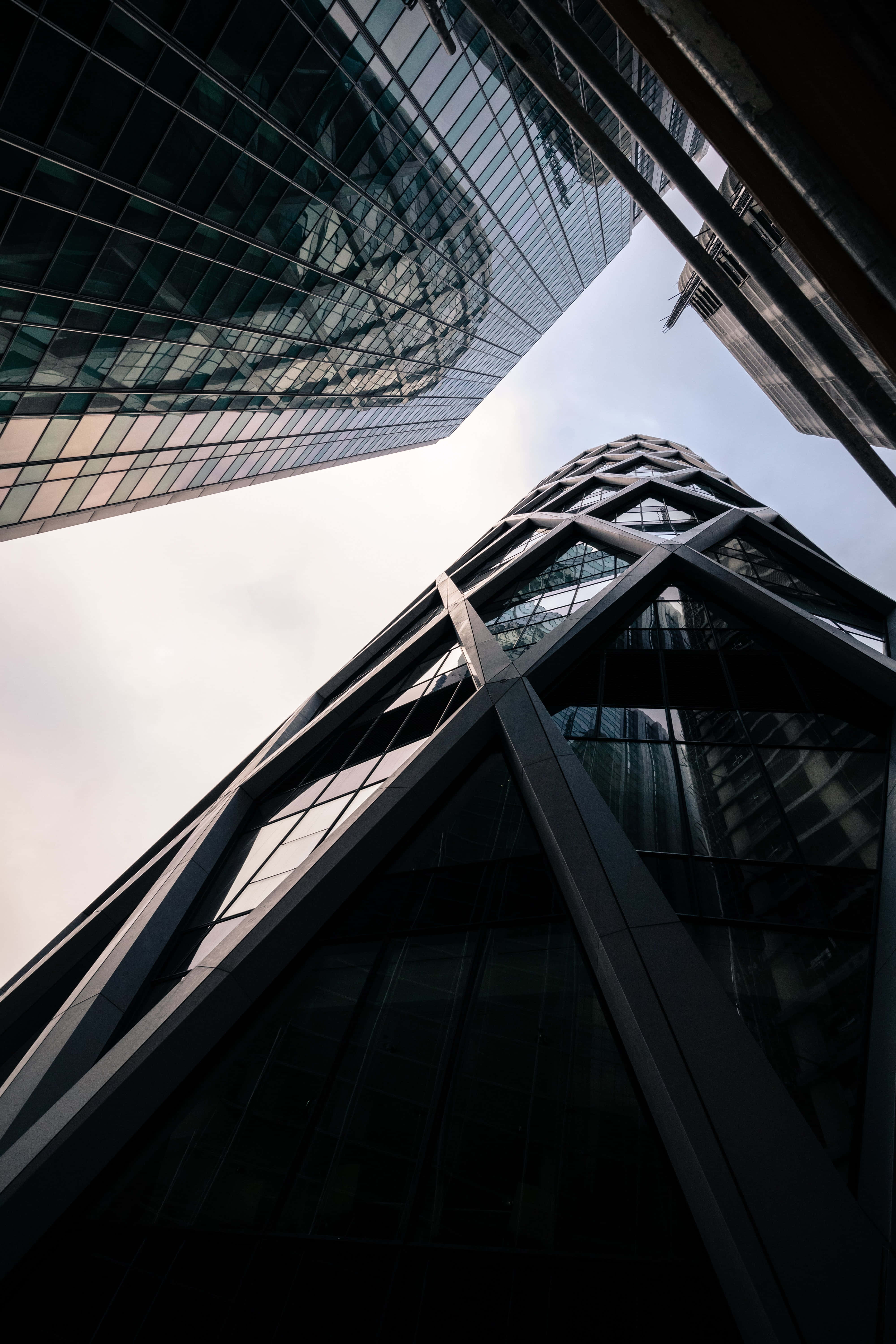 Modern iPhone, glass skyscrapers, geometric facades, 5K Phone Wallpaper