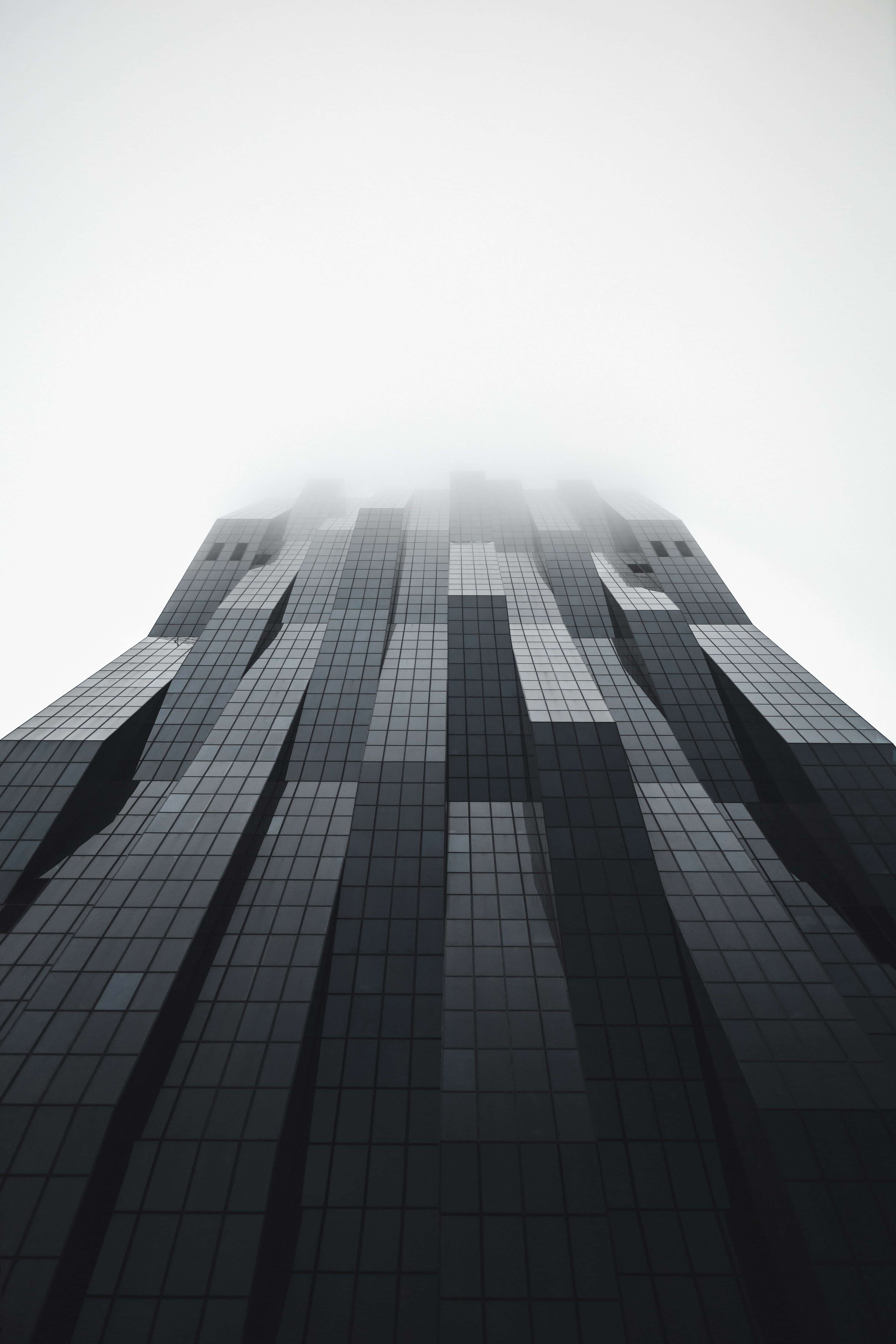 modern iPhone, glass skyscraper, thick fog, 5K Phone Wallpaper