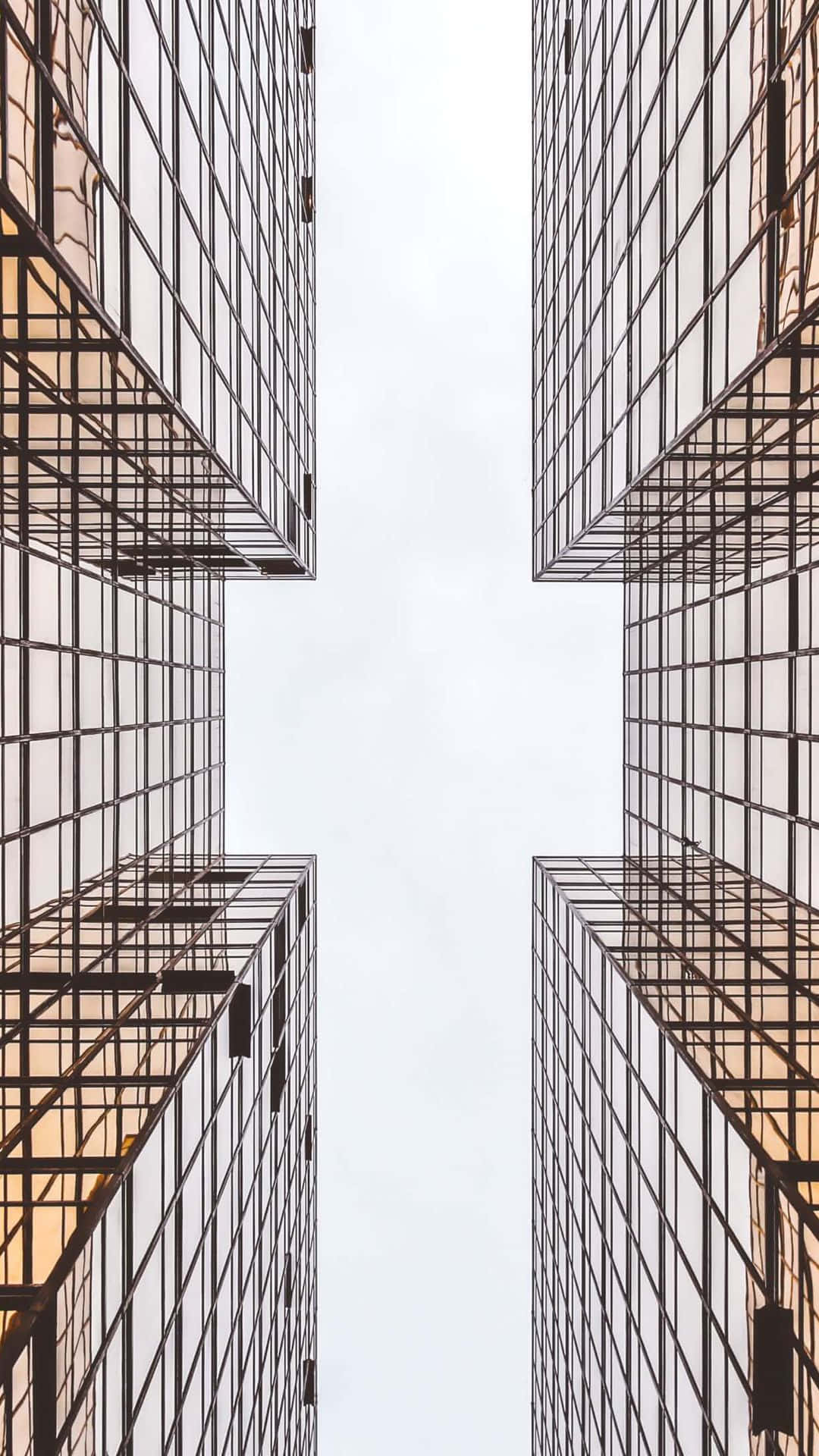 Modern iPhone, glass skyscrapers, pale sky, Full HD Phone Wallpaper