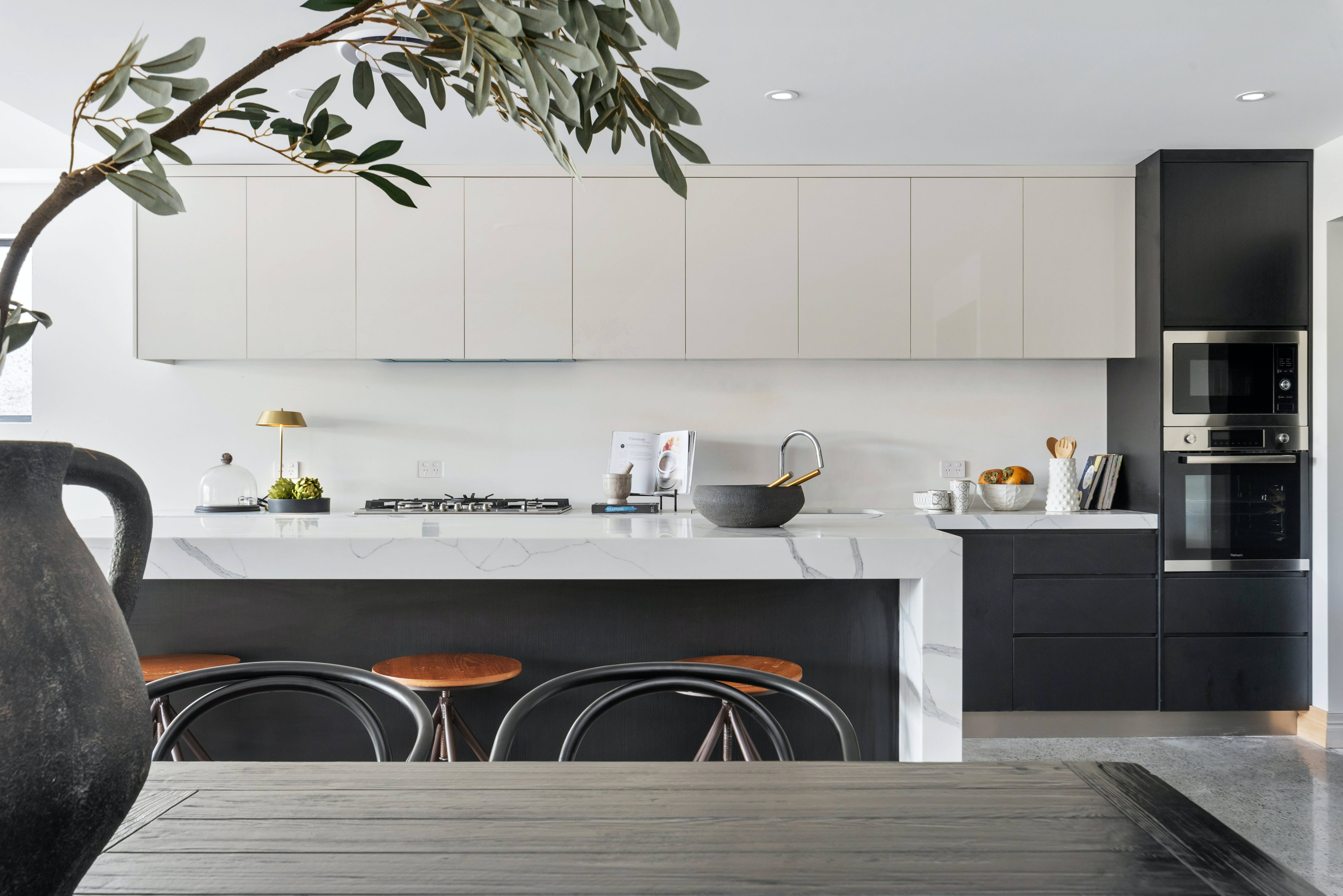 modern galley kitchen, black and white cabinetry, marble island, 5K Desktop Wallpaper