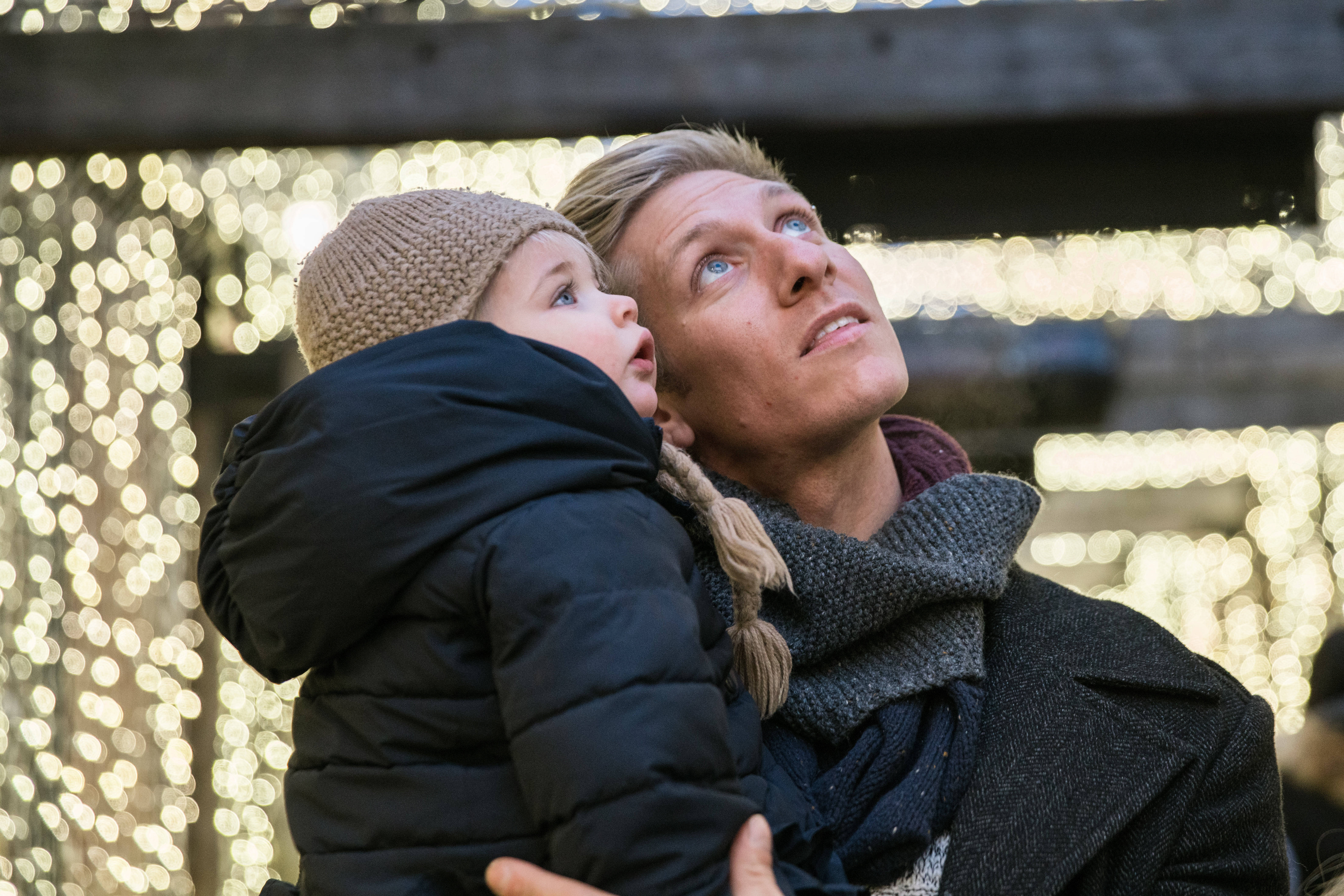 Dad And Daughter Looking Up, knit hat, twinkling string lights, 5K Desktop Wallpaper