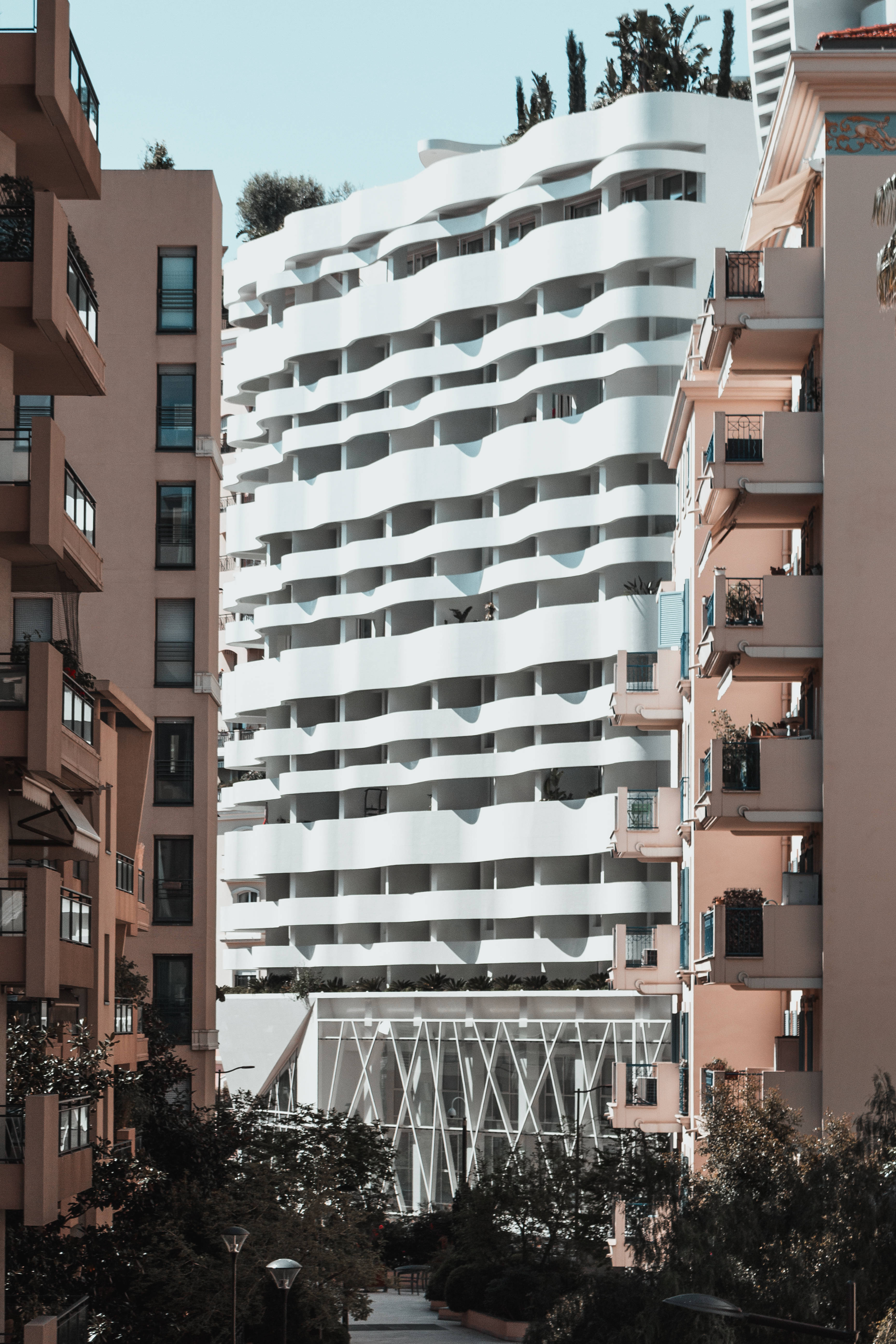 Monaco, white wavy modern building, terracotta-colored apartment blocks, 5K Phone Wallpaper