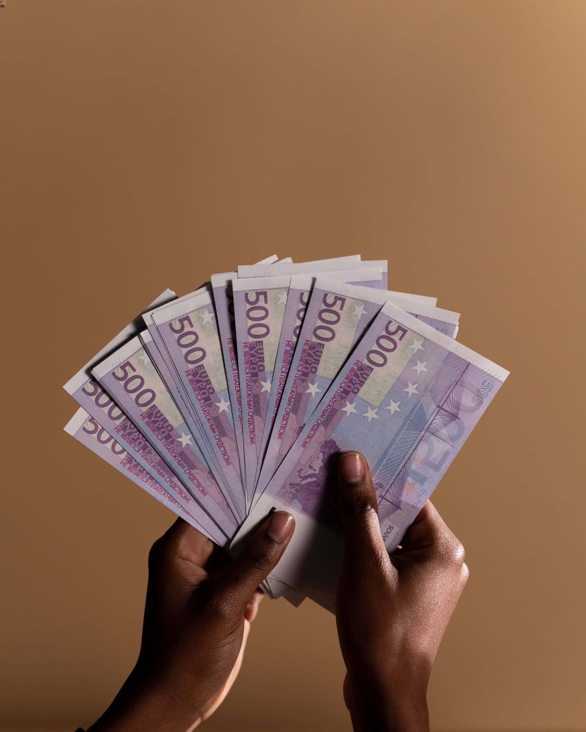 500 euro banknotes, solid brown background, hands, Full HD Phone Wallpaper