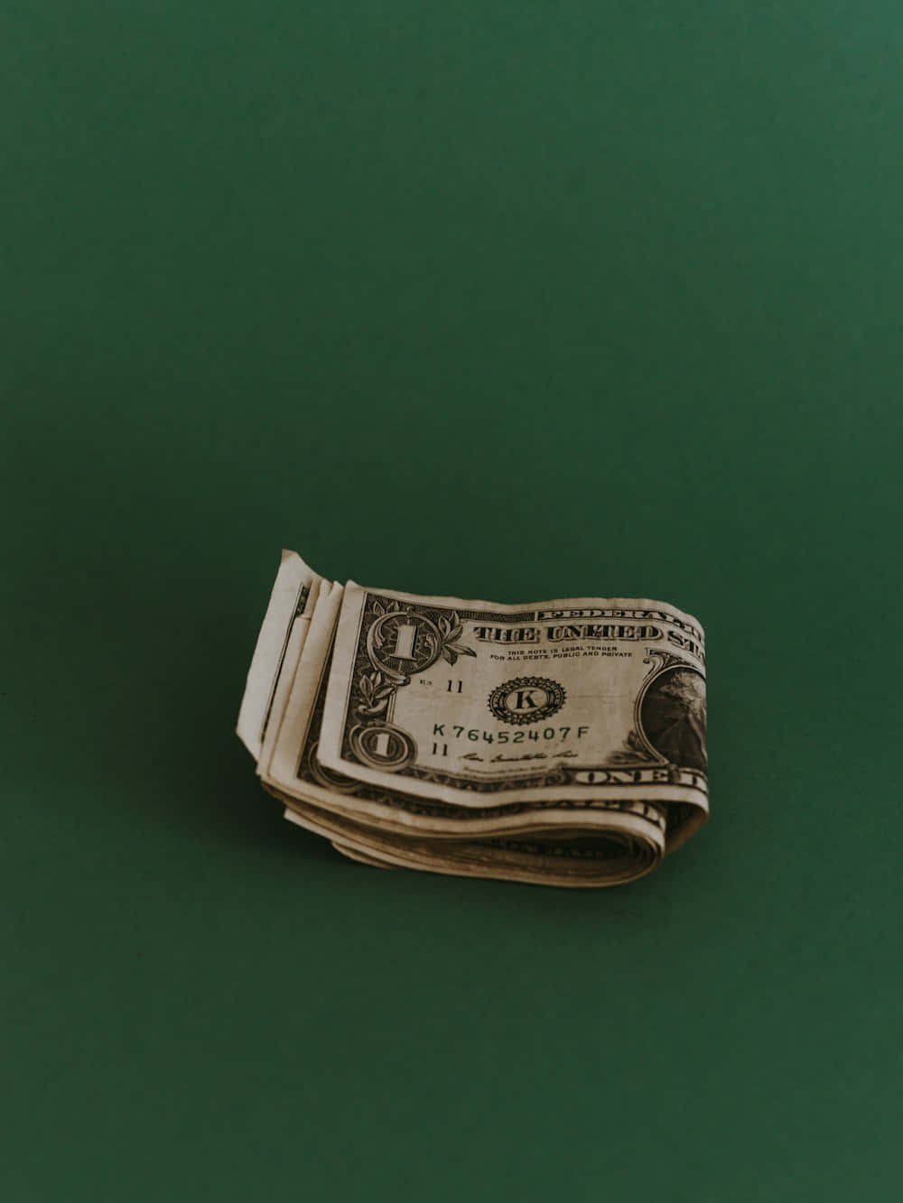 rolled dollar bills, one dollar bills, dark green surface, HD Phone Wallpaper