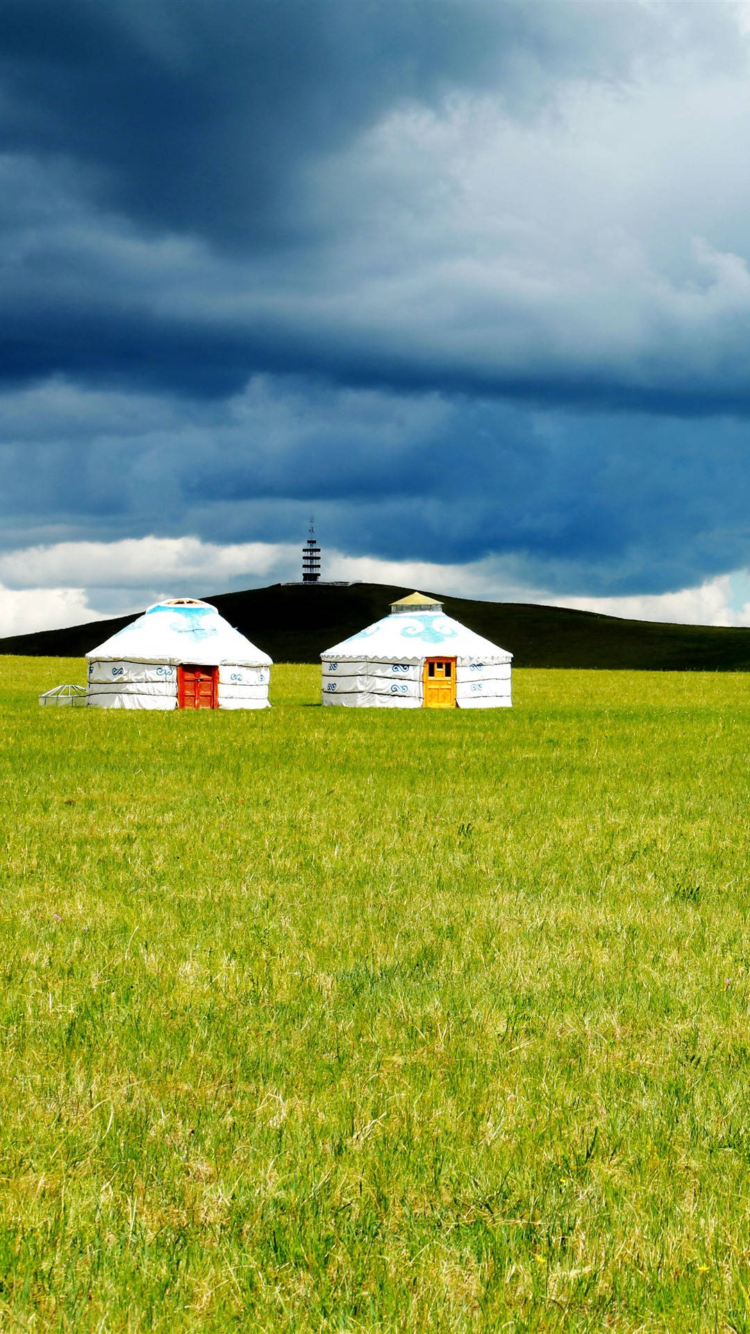 traditional Mongolian yurts, vast green field, dark cloudy sky, Full HD Phone Wallpaper