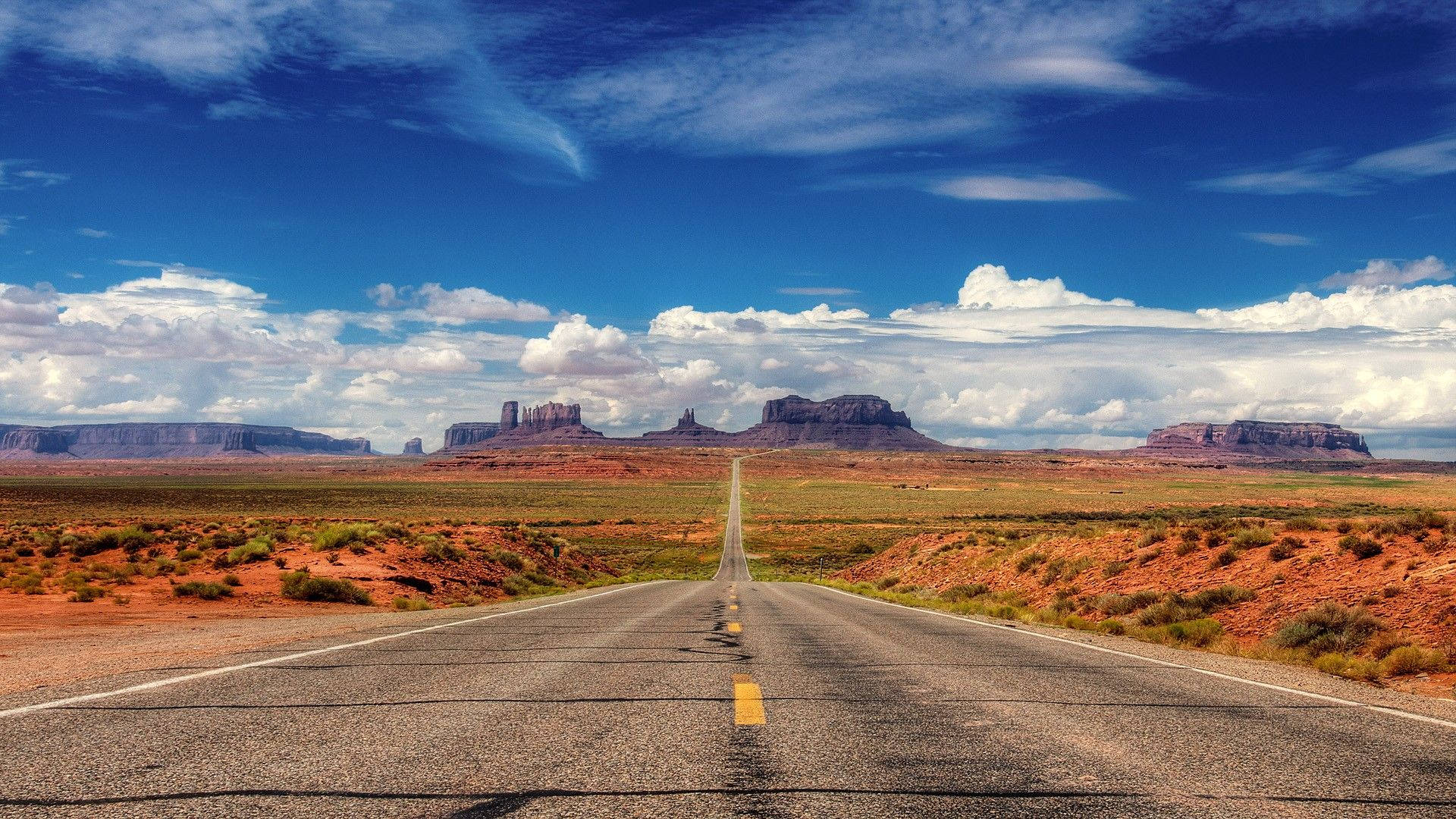 Monument Valley, red rock buttes, asphalt road, Full HD Desktop Wallpaper