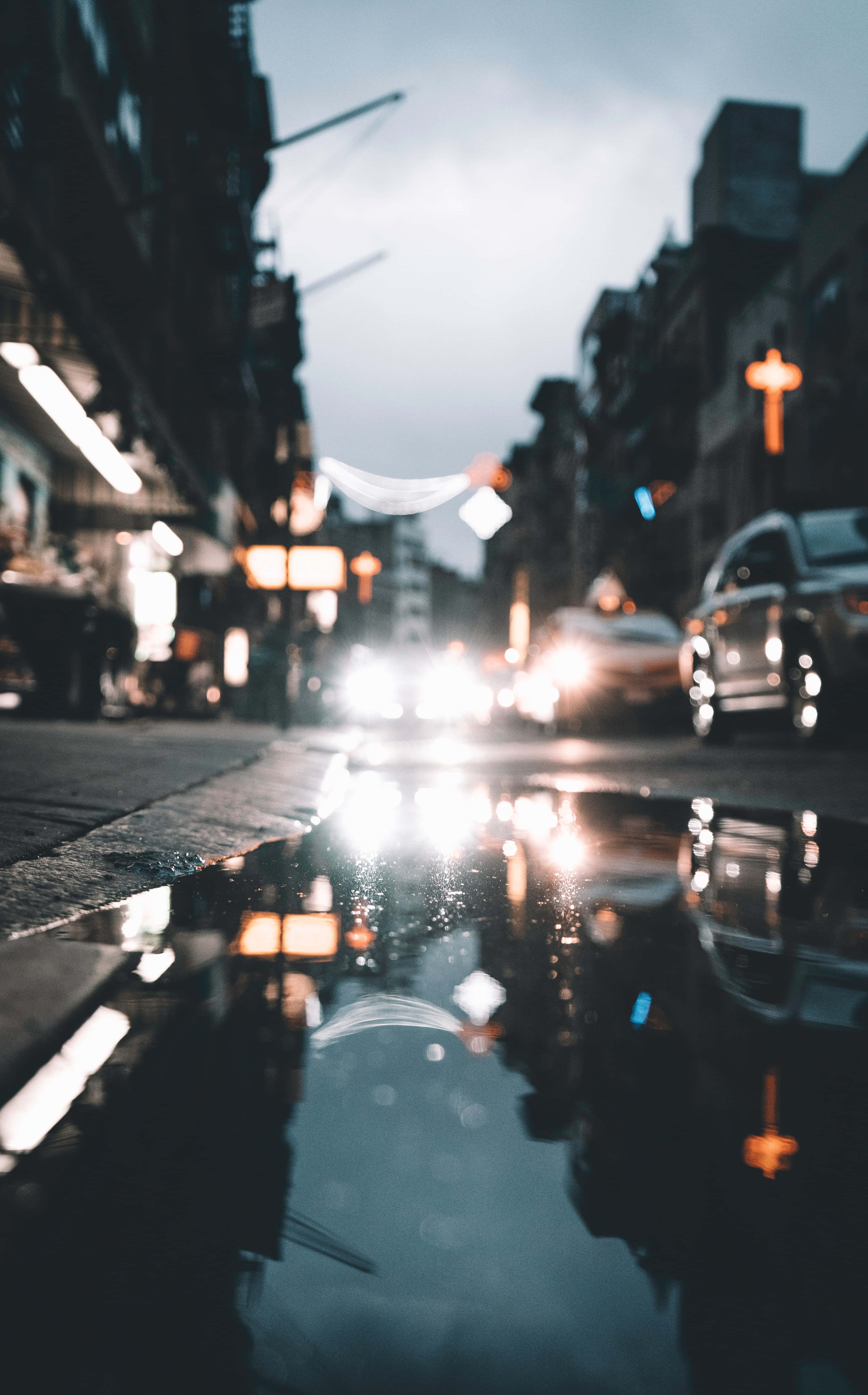Moody Vibe HD Phone, rain-slicked city street, dusk, 5K Phone Wallpaper