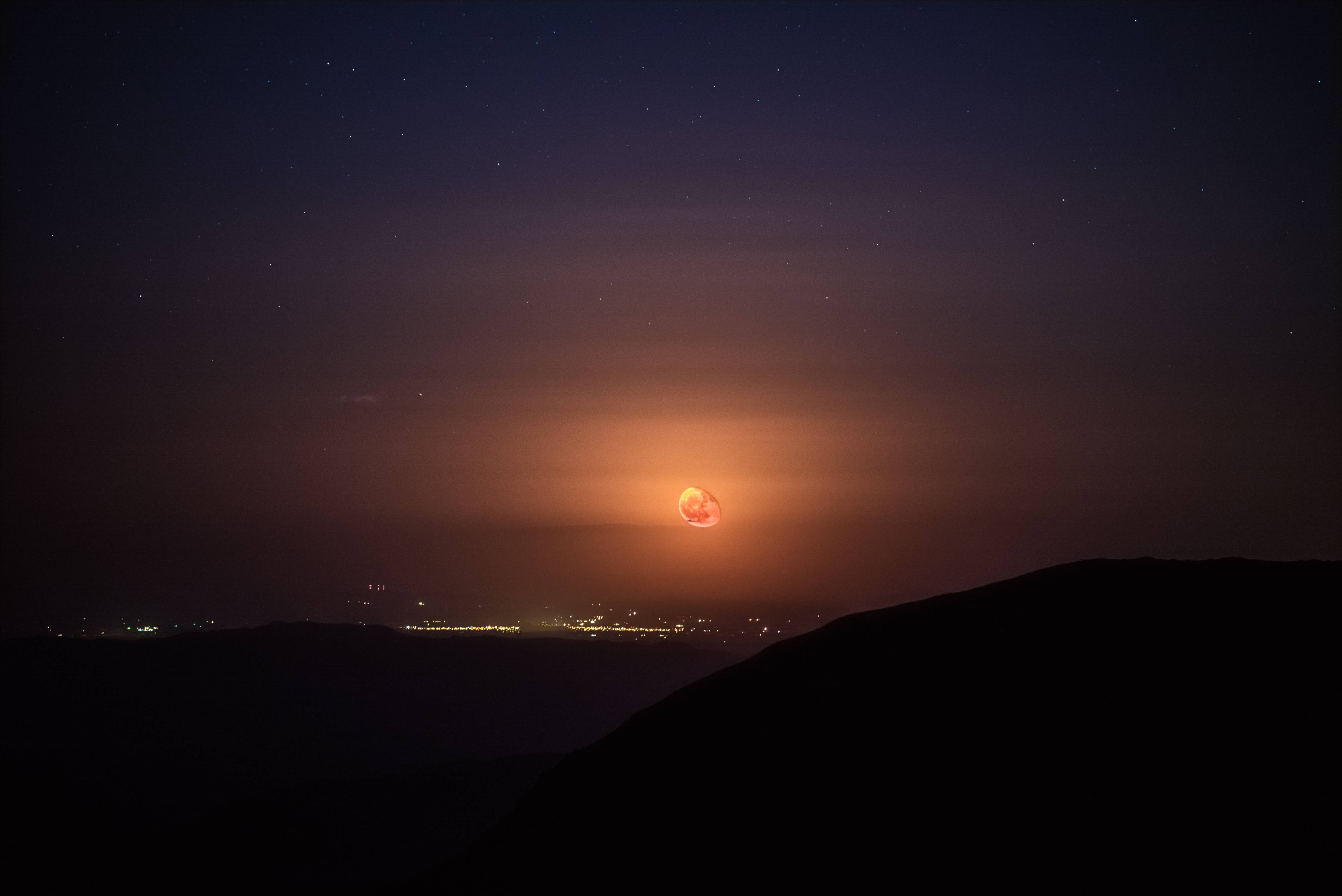 Bewitching Sunset Moon Desktop, glowing orange moon, dark hillside, 4K Desktop Wallpaper