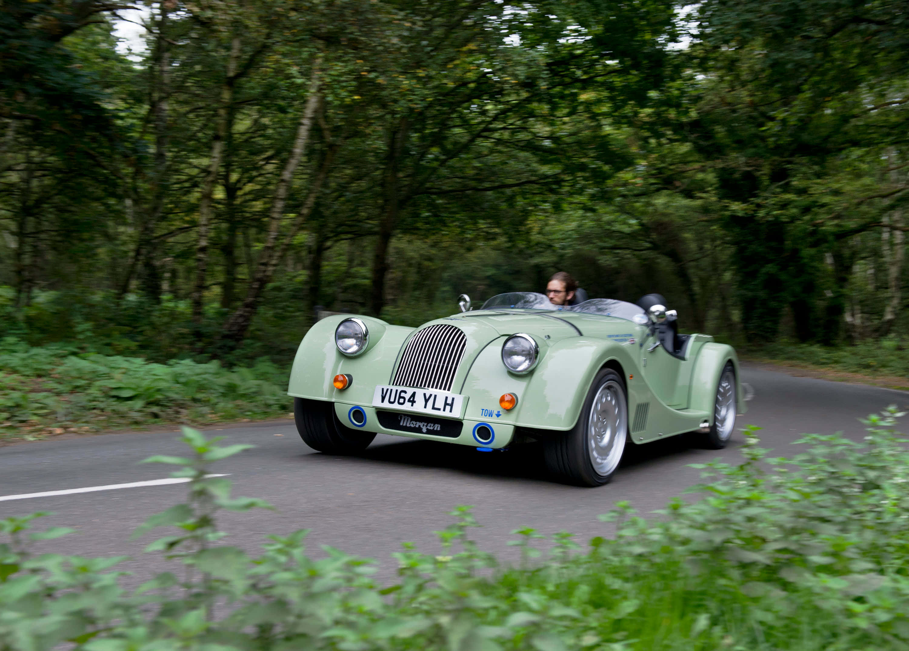 Morgan Plus 8, mint green, winding forest road, 2K Desktop Wallpaper