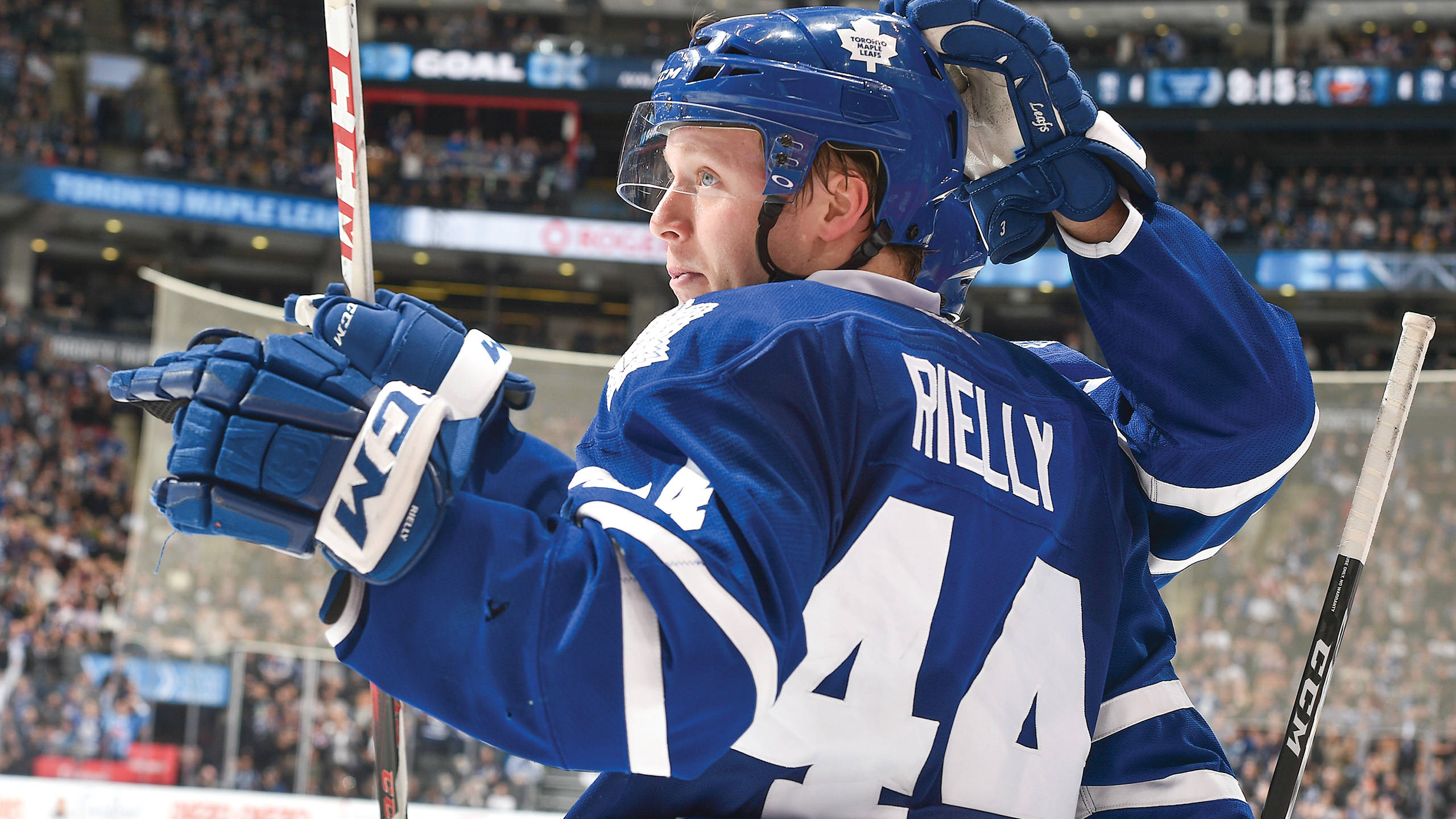 Morgan Rielly, blue Toronto Maple Leafs jersey, raised stick, 2K Desktop Wallpaper