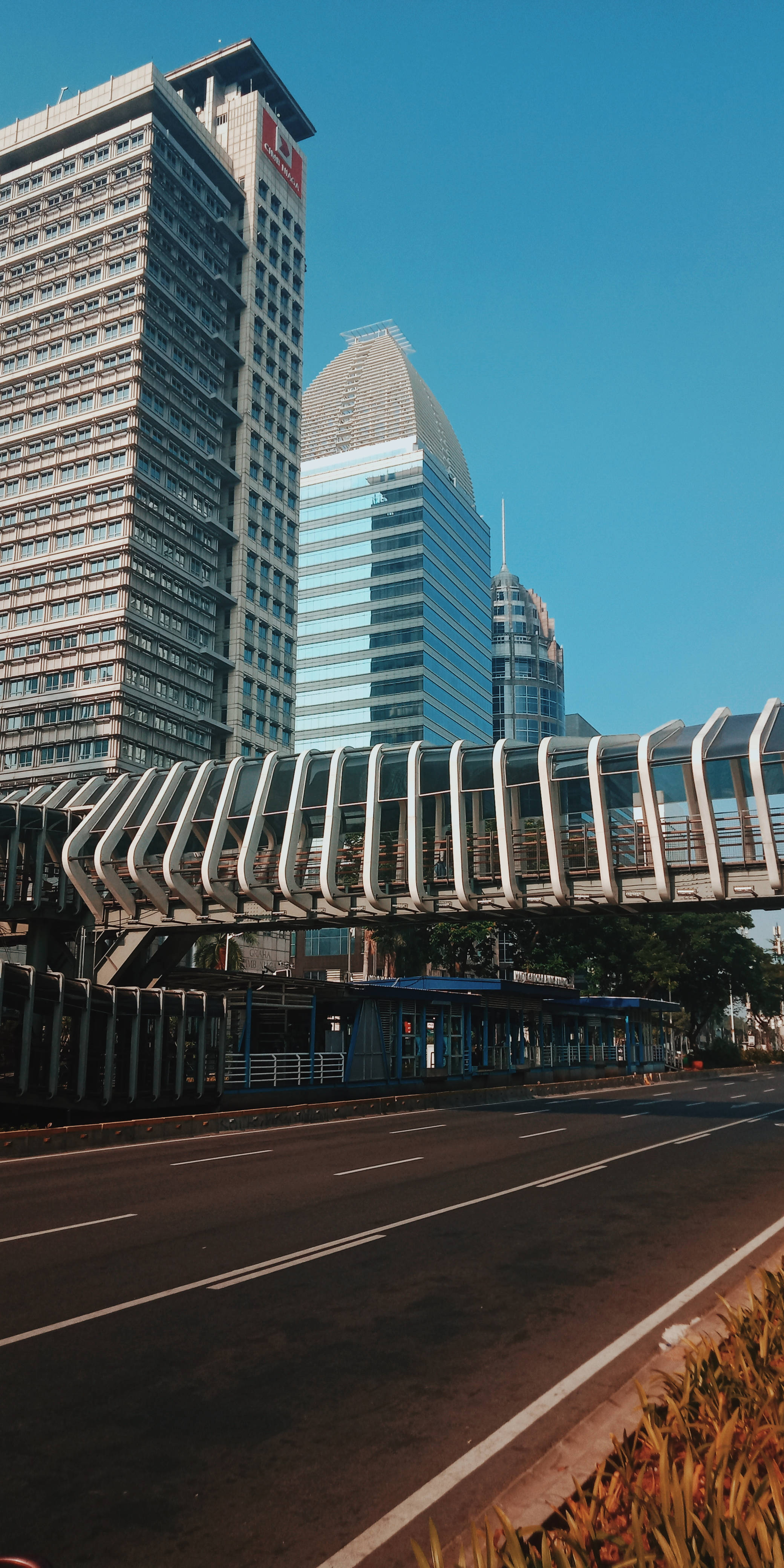 Morning City, glass skyscrapers, curved pedestrian bridge, 4K Phone Wallpaper