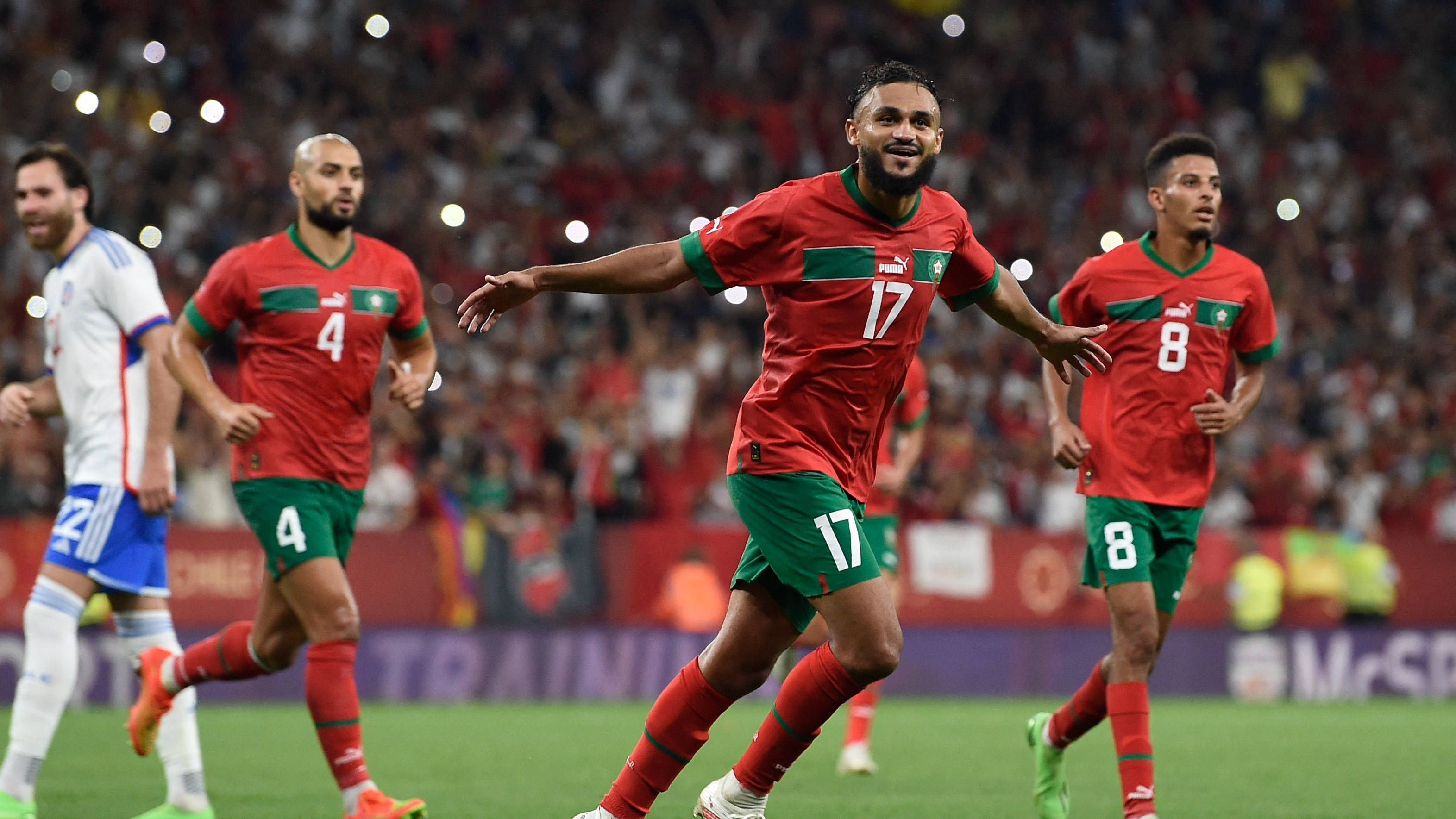 Morocco National Football Team, red and green uniforms, vibrant stadium field, 2K Desktop Wallpaper