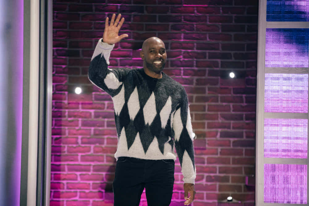 Morris Chestnut, black and white diamond-patterned sweater, purple-lit brick wall, SD Desktop Wallpaper