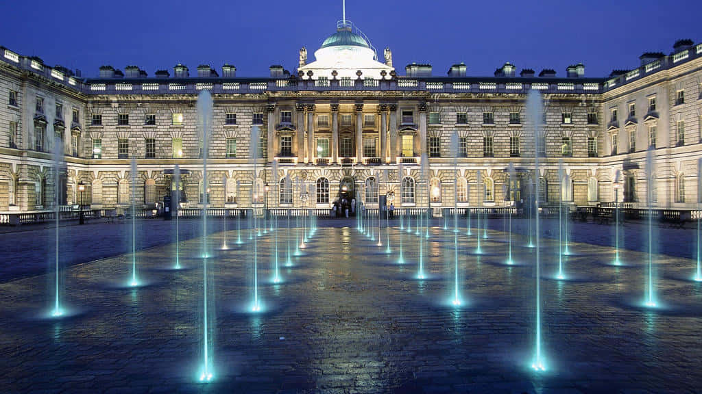Grand neoclassical building, dusk, glowing blue fountains, SD Desktop Wallpaper