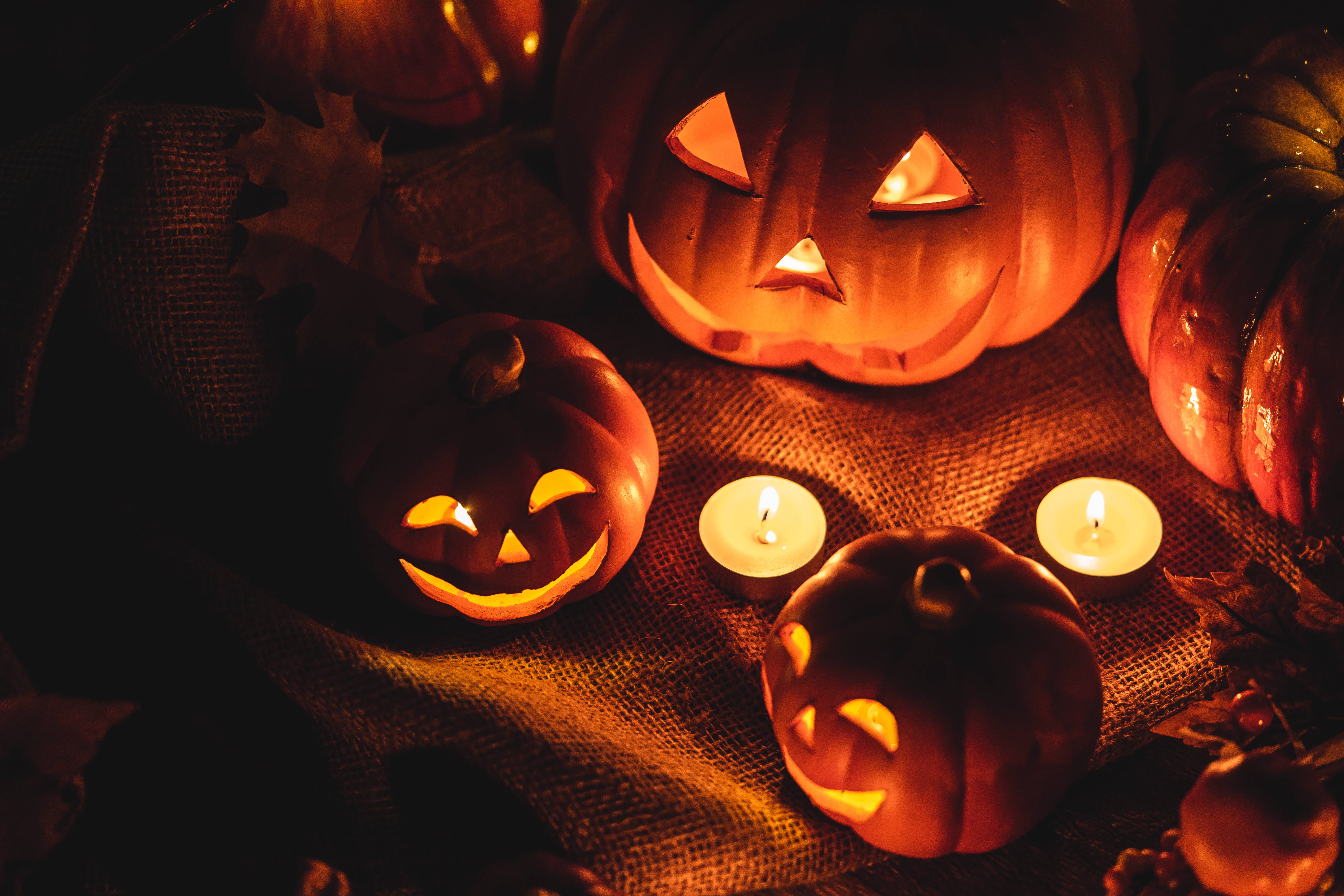 orange Halloween pumpkins, jack-o'-lanterns, candles, 5K Desktop Wallpaper