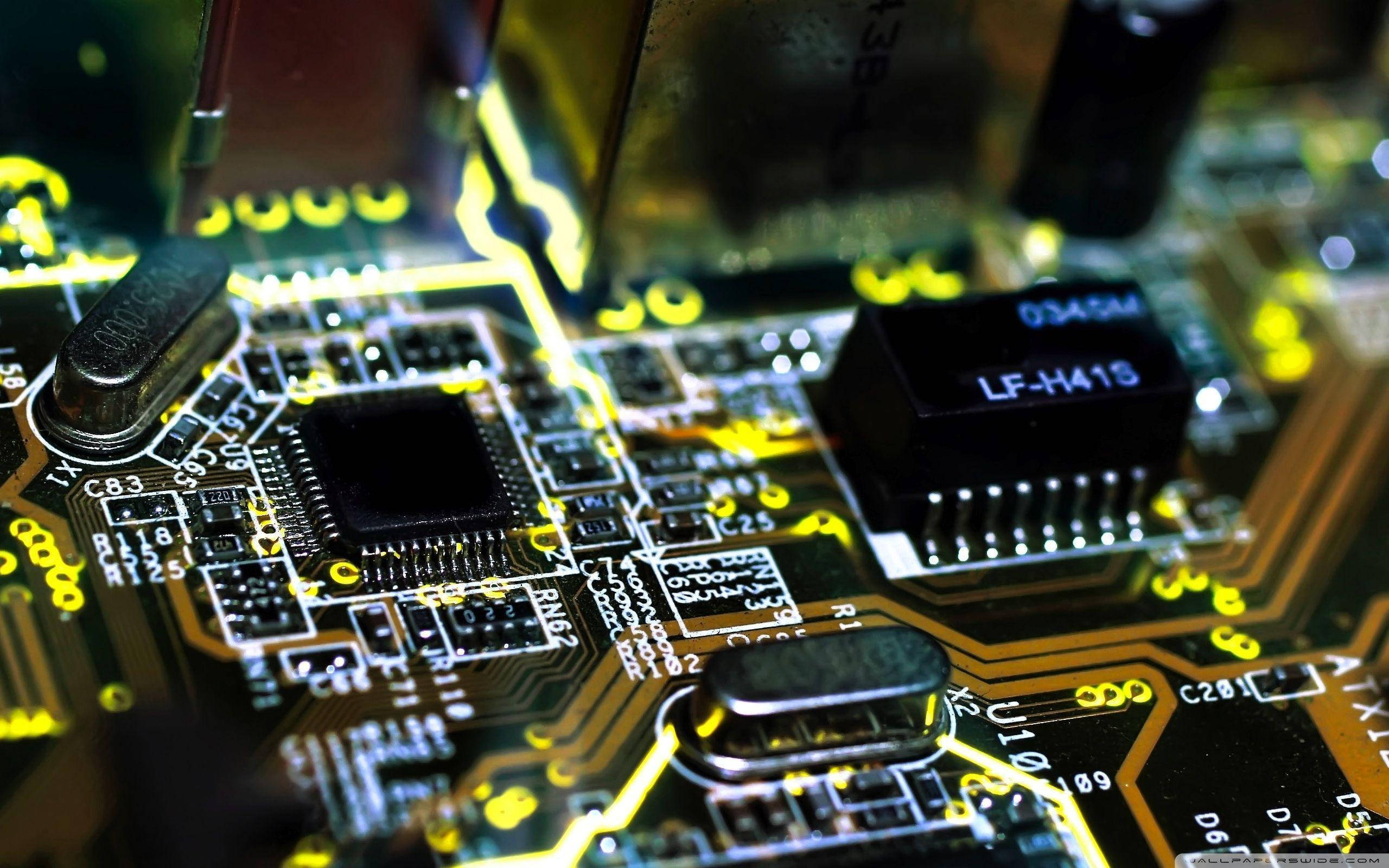 Motherboard, yellow circuit board, glowing, 2K Desktop Wallpaper