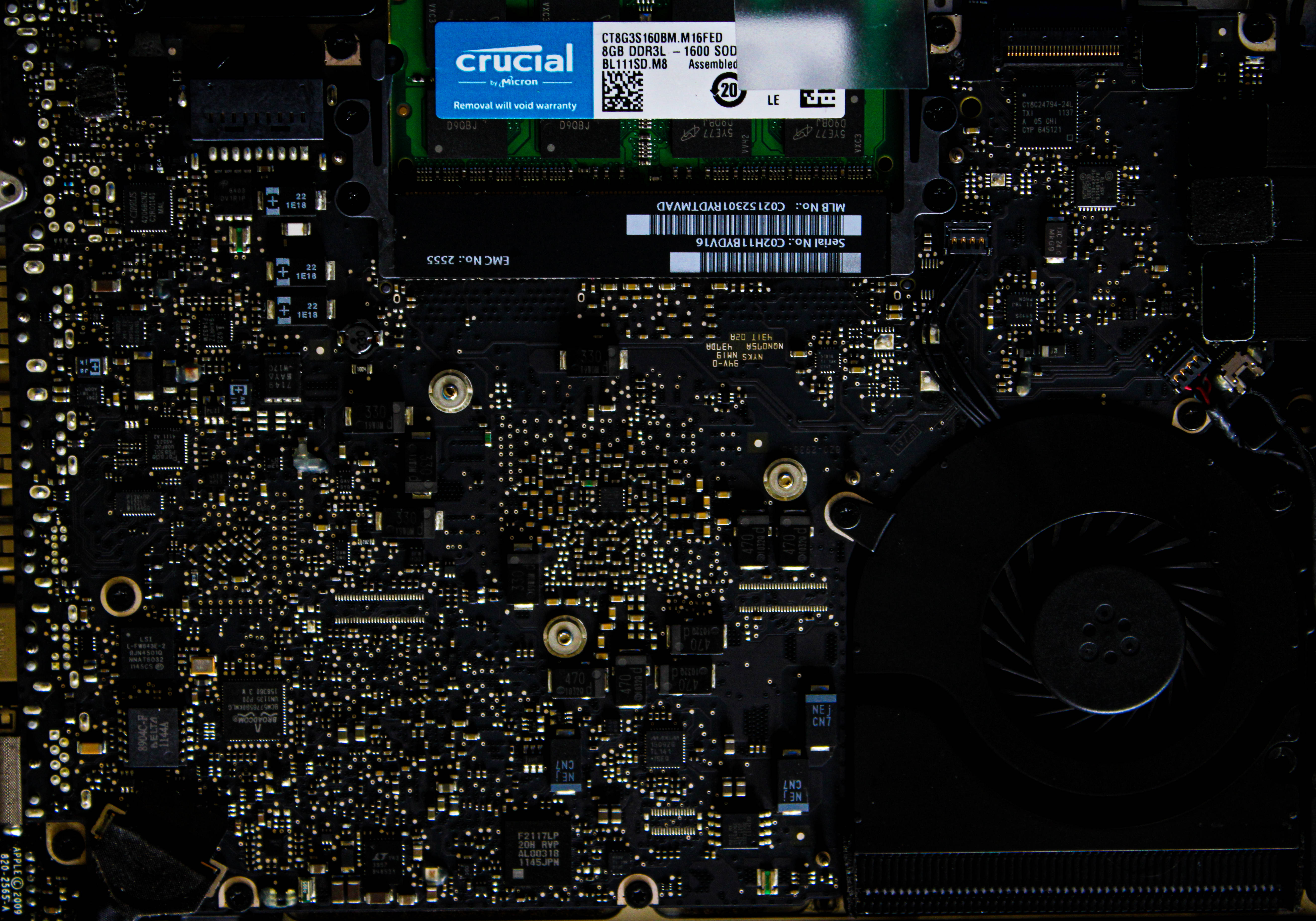 laptop motherboard, glowing golden circuitry, Crucial RAM module, 5K Desktop Wallpaper