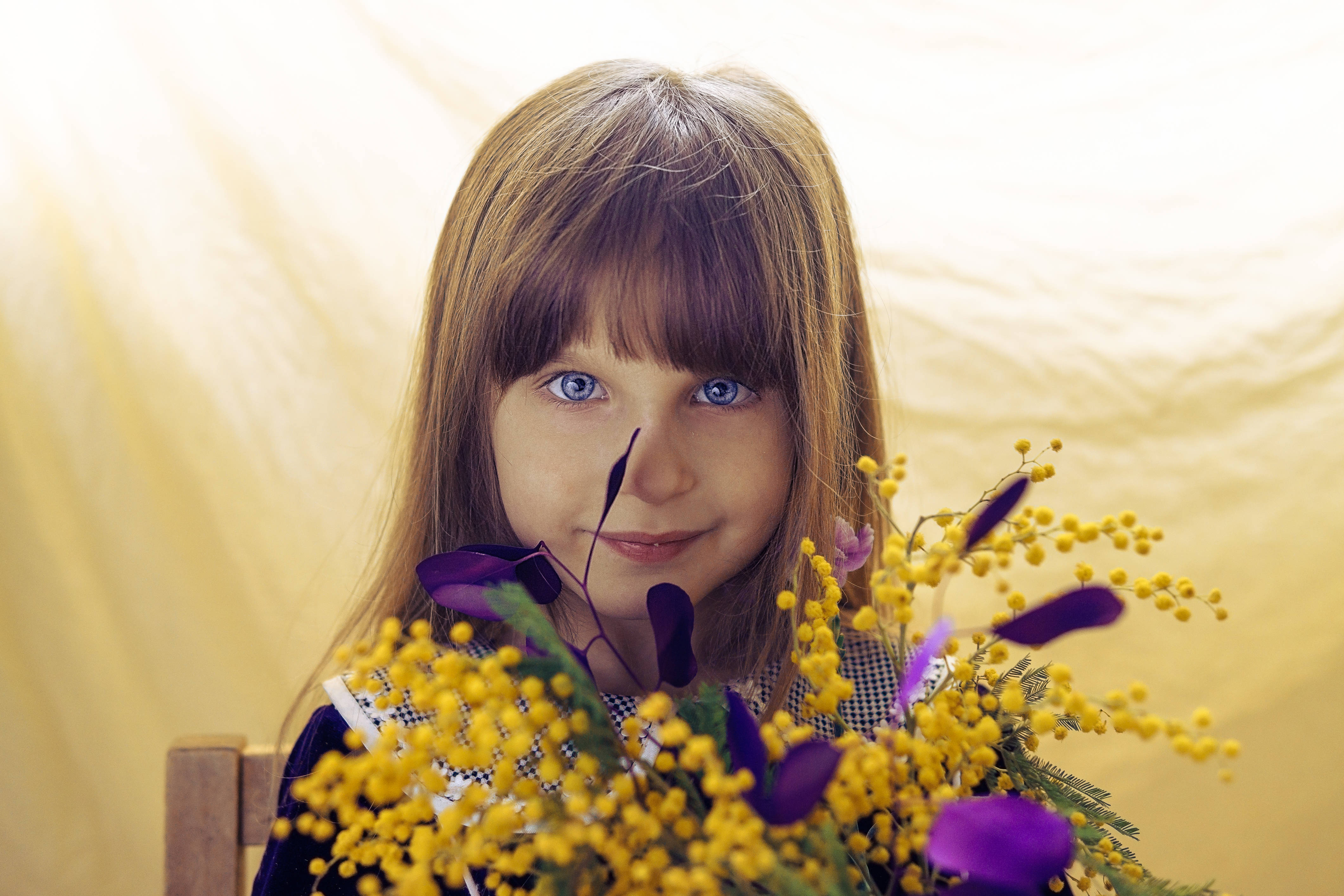 yellow and purple bouquet, young girl with blue eyes and brown hair, vibrant bouquet of yellow and purple flowers, 4K Desktop Wallpaper