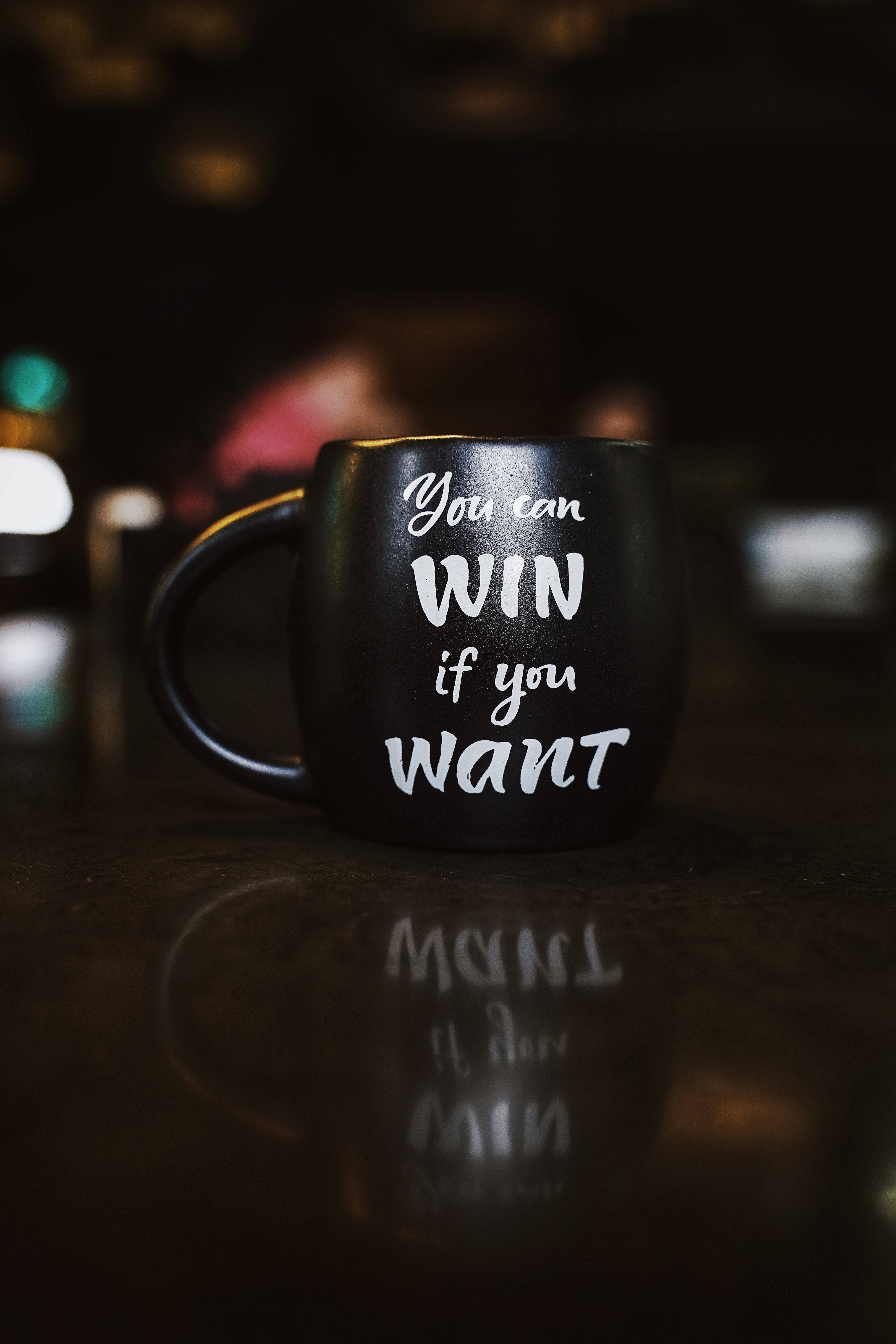 black mug, white motivational text, reflective surface, 5K Phone Wallpaper