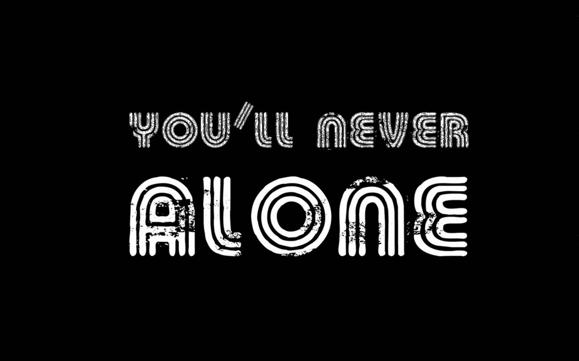YOU'LL NEVER ALONE, white distressed typography, stark black background, Full HD Desktop Wallpaper