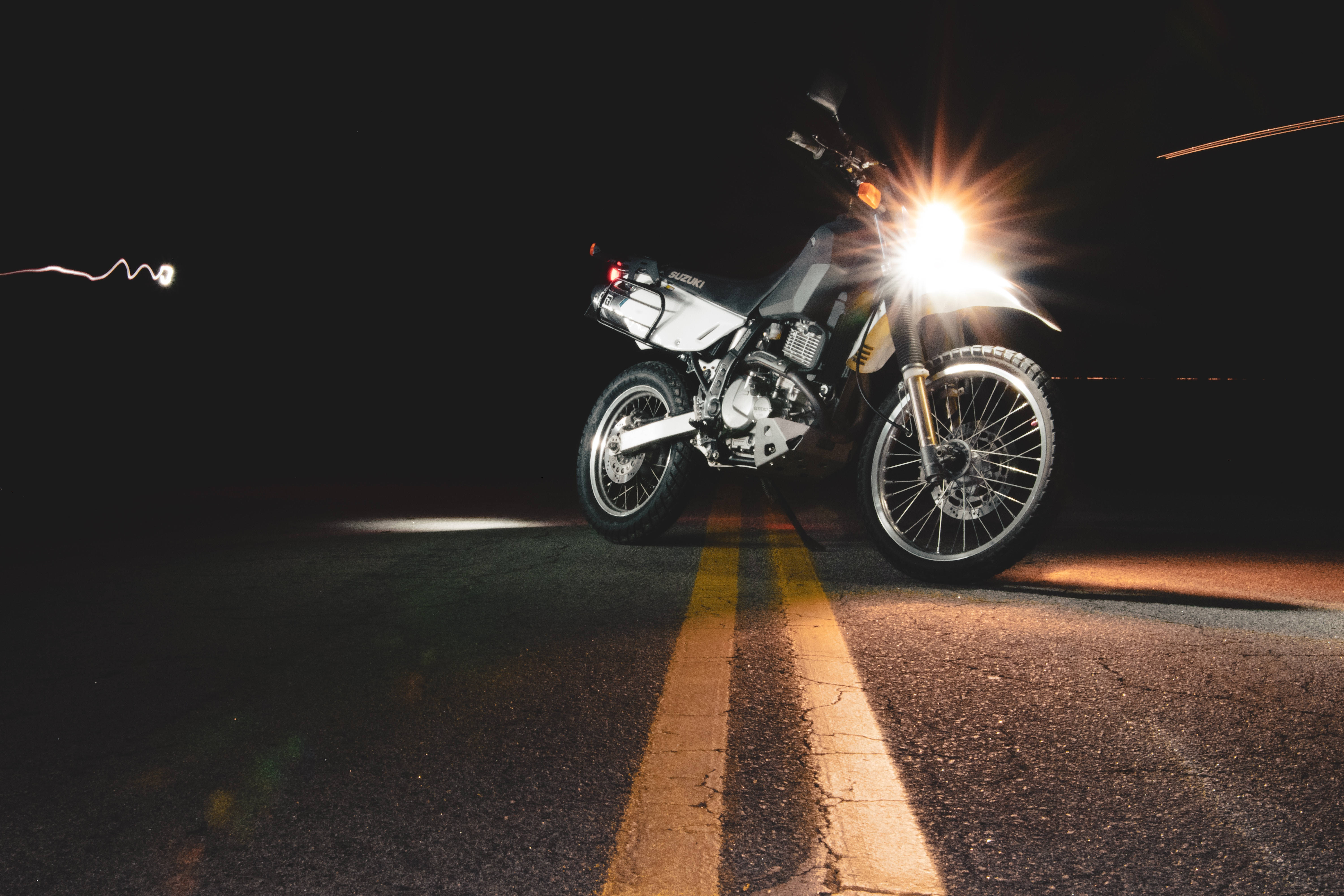 silver motorcycle, glowing headlights, dark road, 5K Desktop Wallpaper