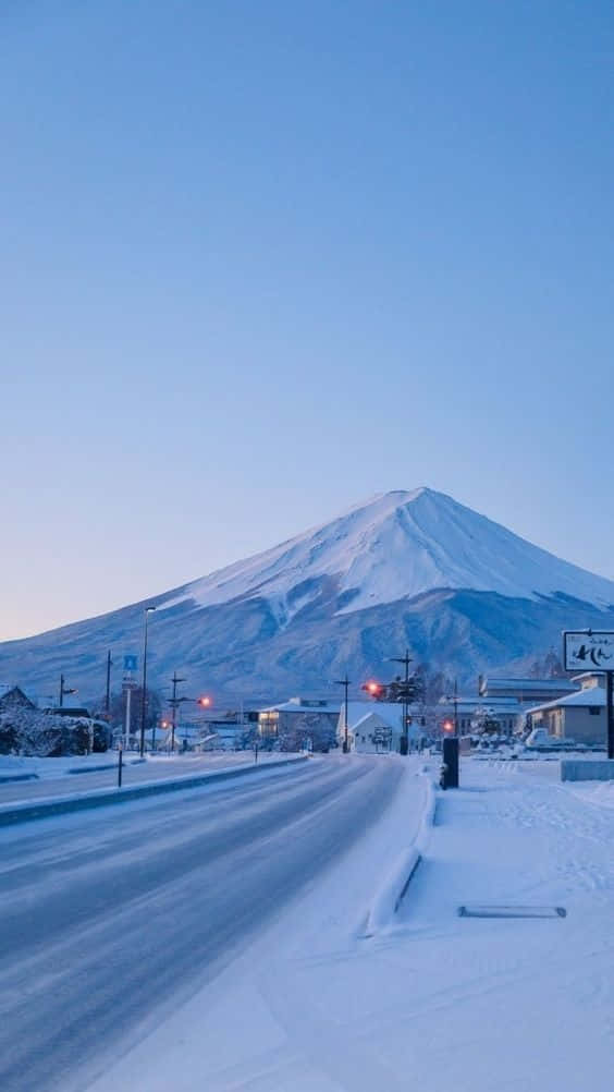Mount Fuji, snow-covered road, clear blue sky, SD Phone Wallpaper