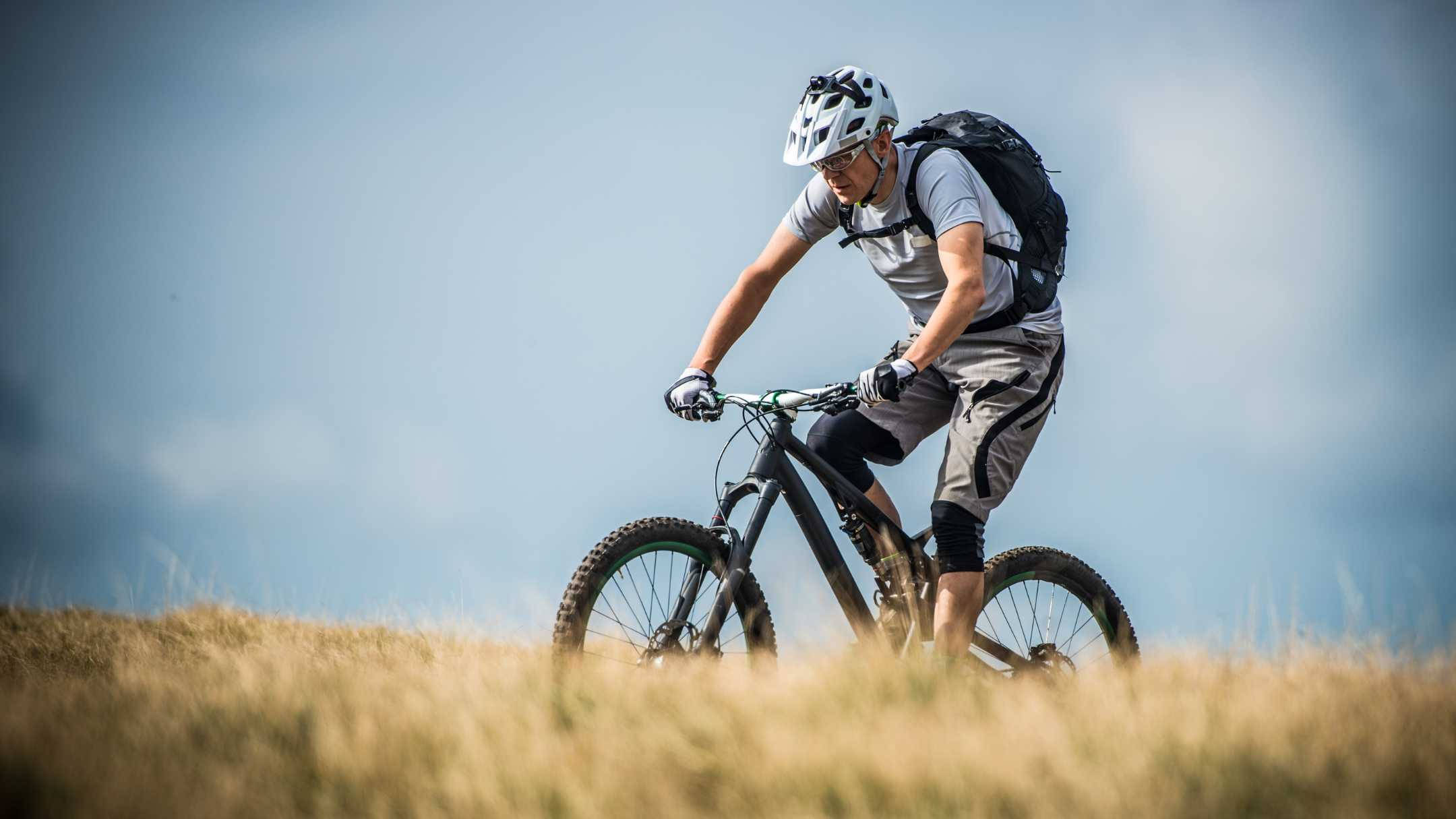 mountain bike, grassy hill, clear blue sky, Full HD Desktop Wallpaper